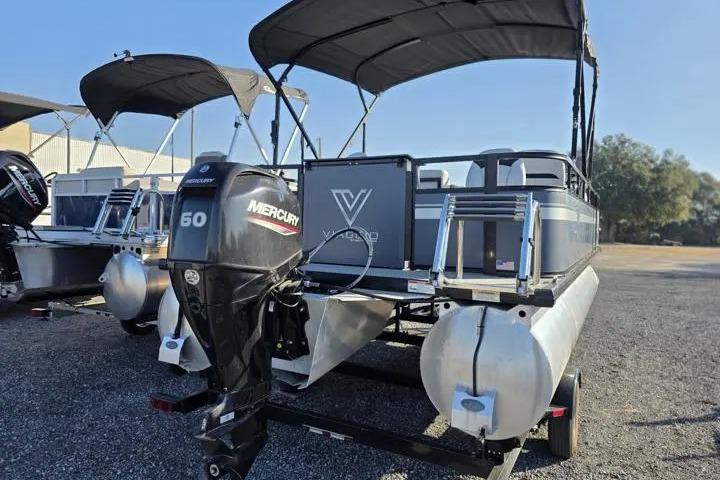 2021 Misty Harbor Del Mar 18F pontoon boat with Mercury 60 engine, parked outdoors.