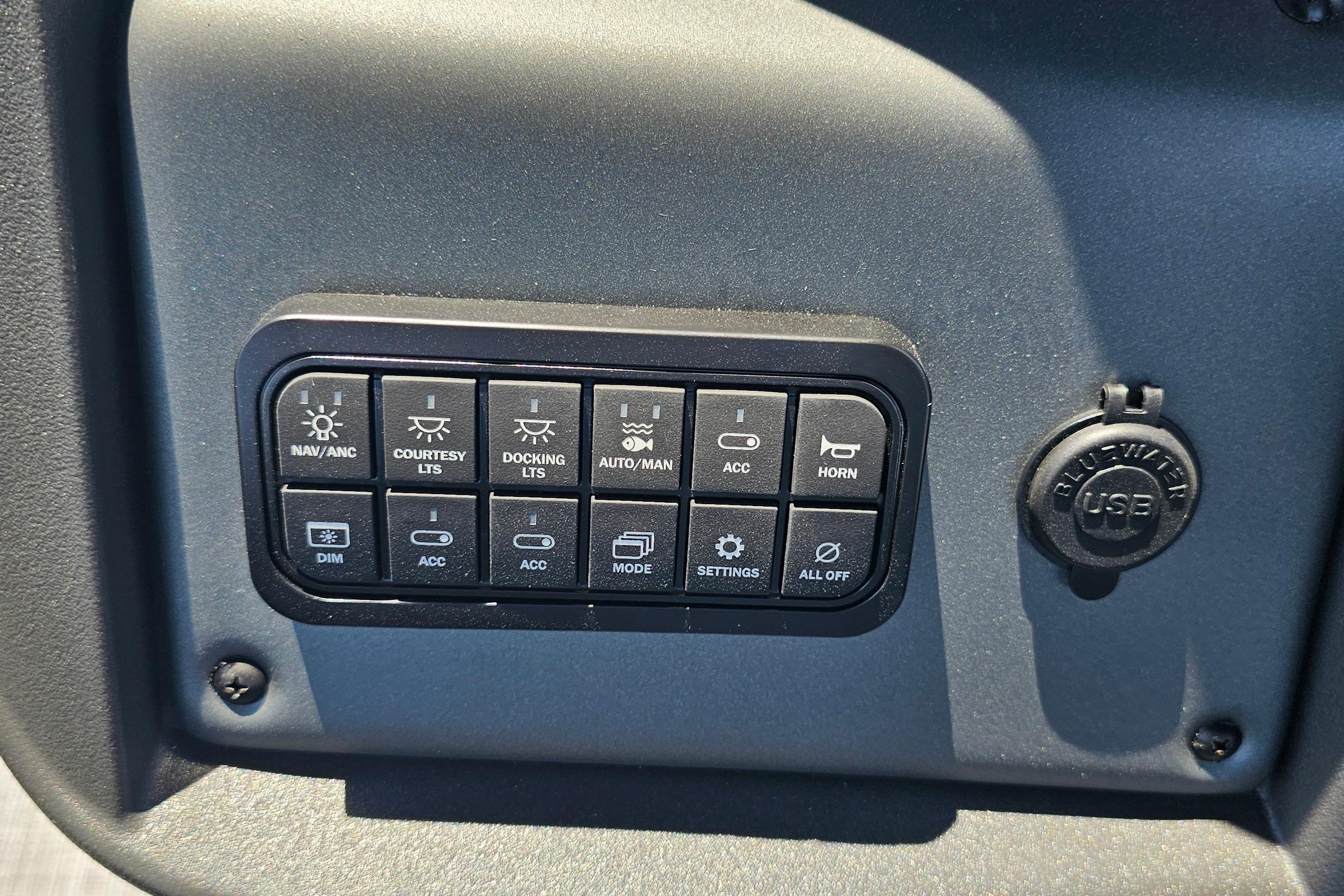 Control panel of 2026 Sun Tracker SportFish 20 DLX with various function buttons.