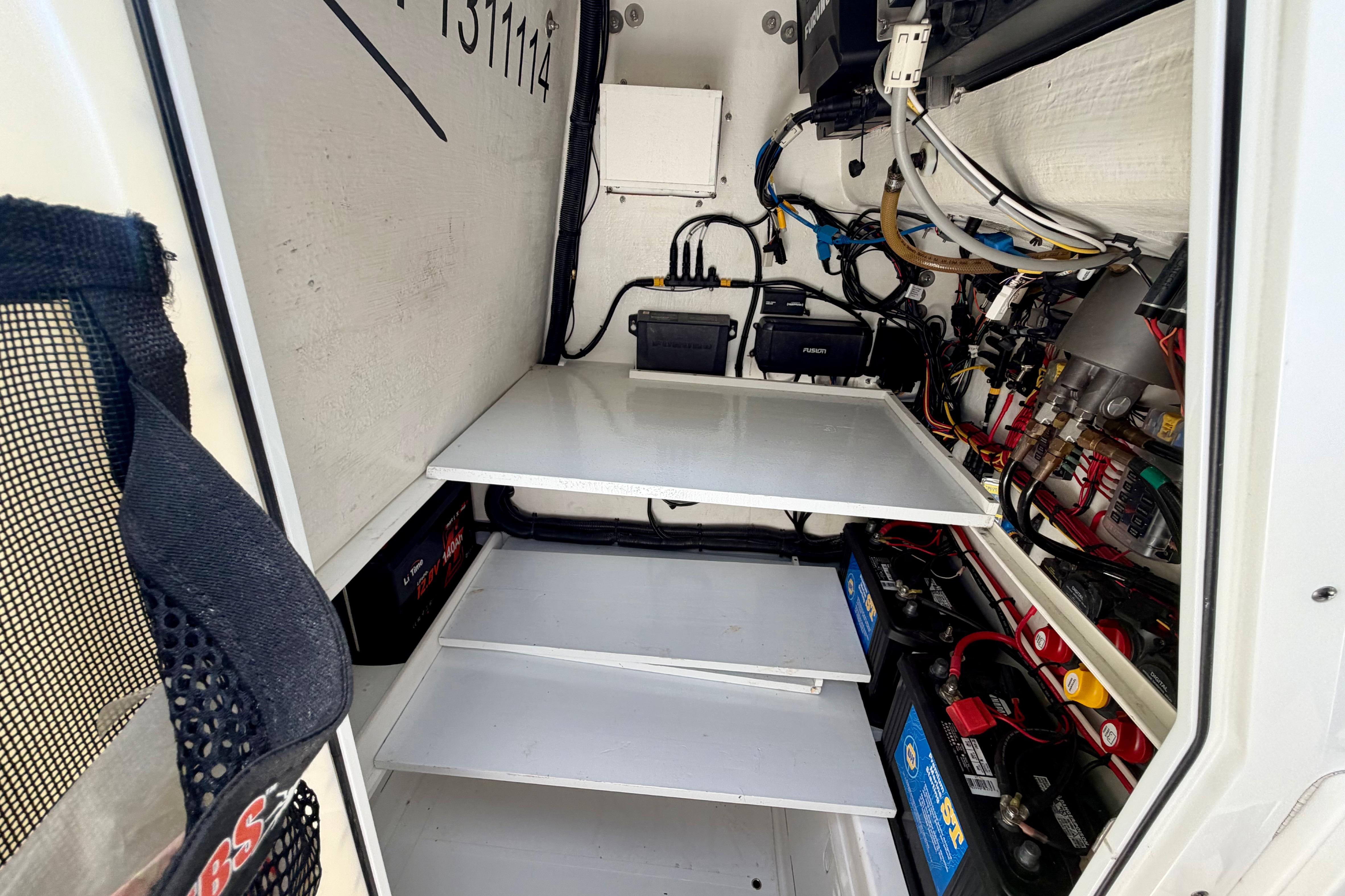 Interior view of 2025 Ocean Master 296 Center Console's electrical compartment.