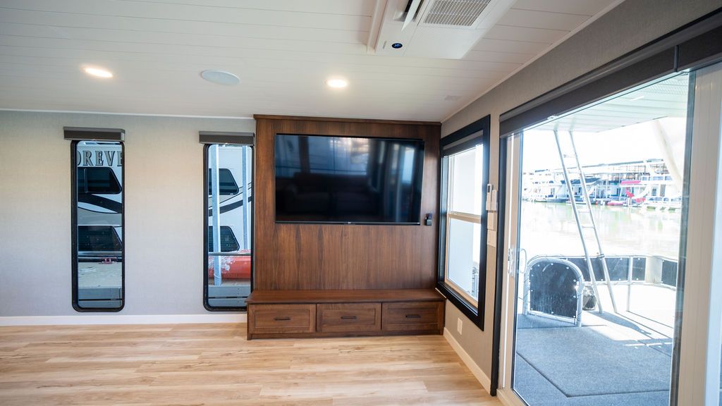 Interior of a 1999 Sumerset Widebody houseboat with TV.