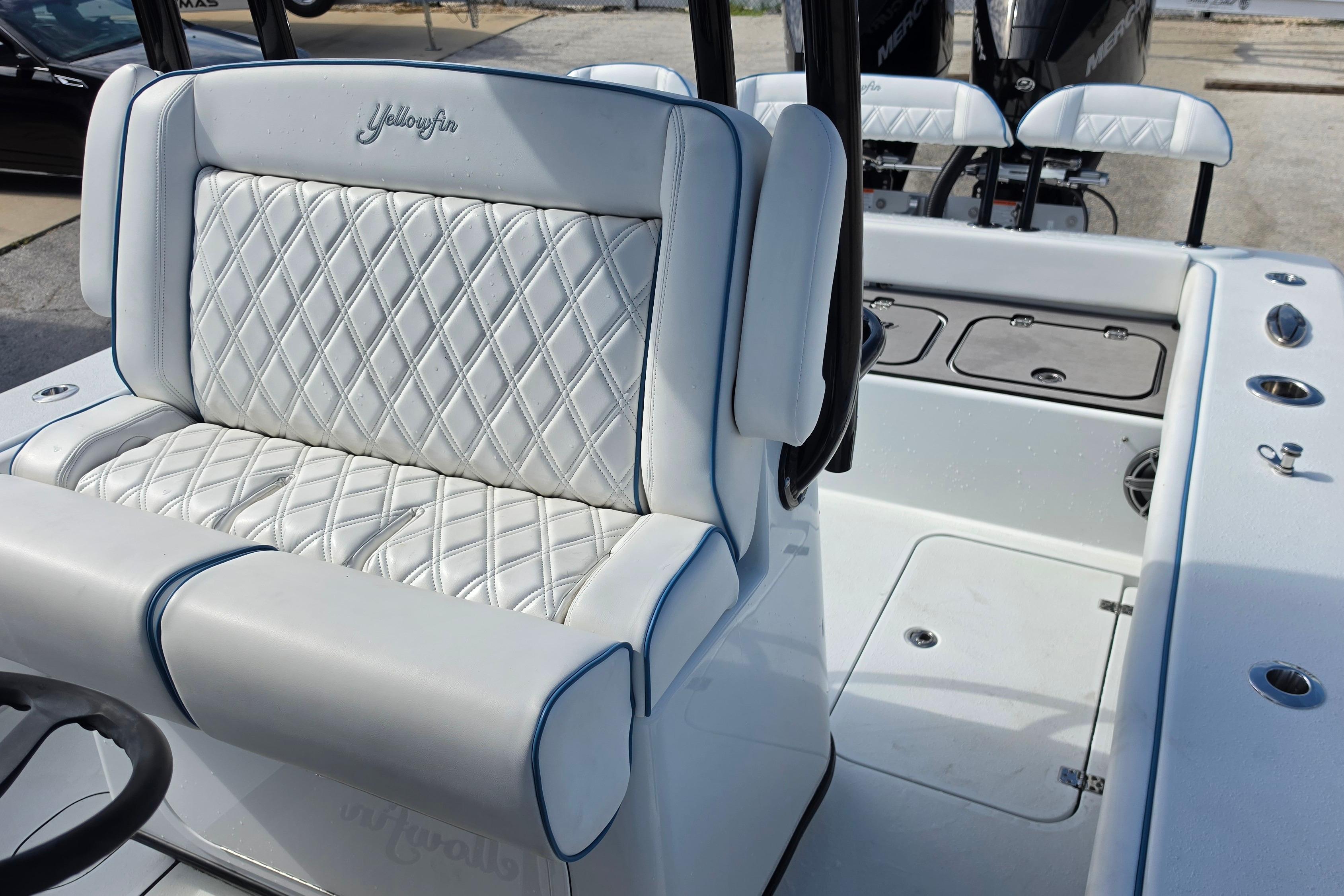 2025 Yellowfin 26 Hybrid boat interior with diamond-stitched seating and modern design.