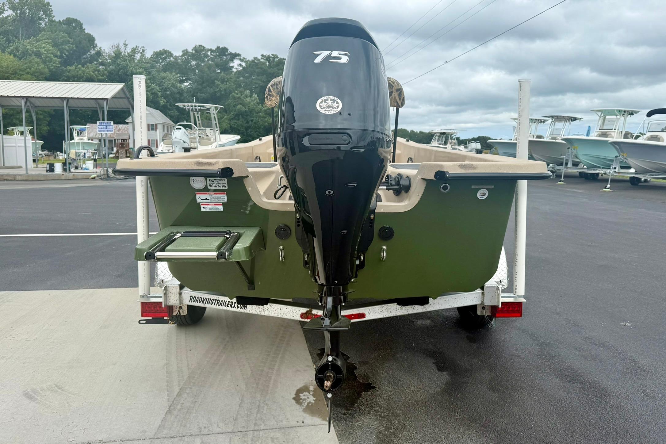 2026 Carolina Skiff E18 JVX CC boat on trailer, featuring a 75 HP outboard motor.