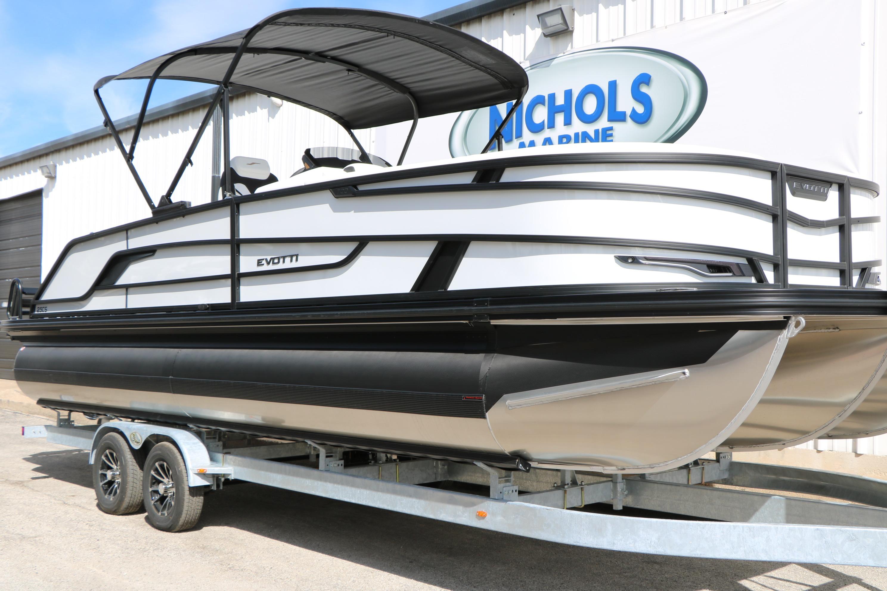 2026 Evotti 725 CS Tri-Toon boat on trailer at Nichols Marine dealership.