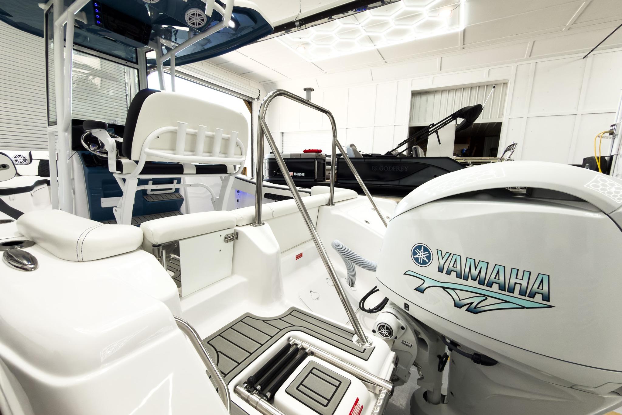 The image shows the stern of a Tidewater 220 LXF boat with a Yamaha outboard motor.