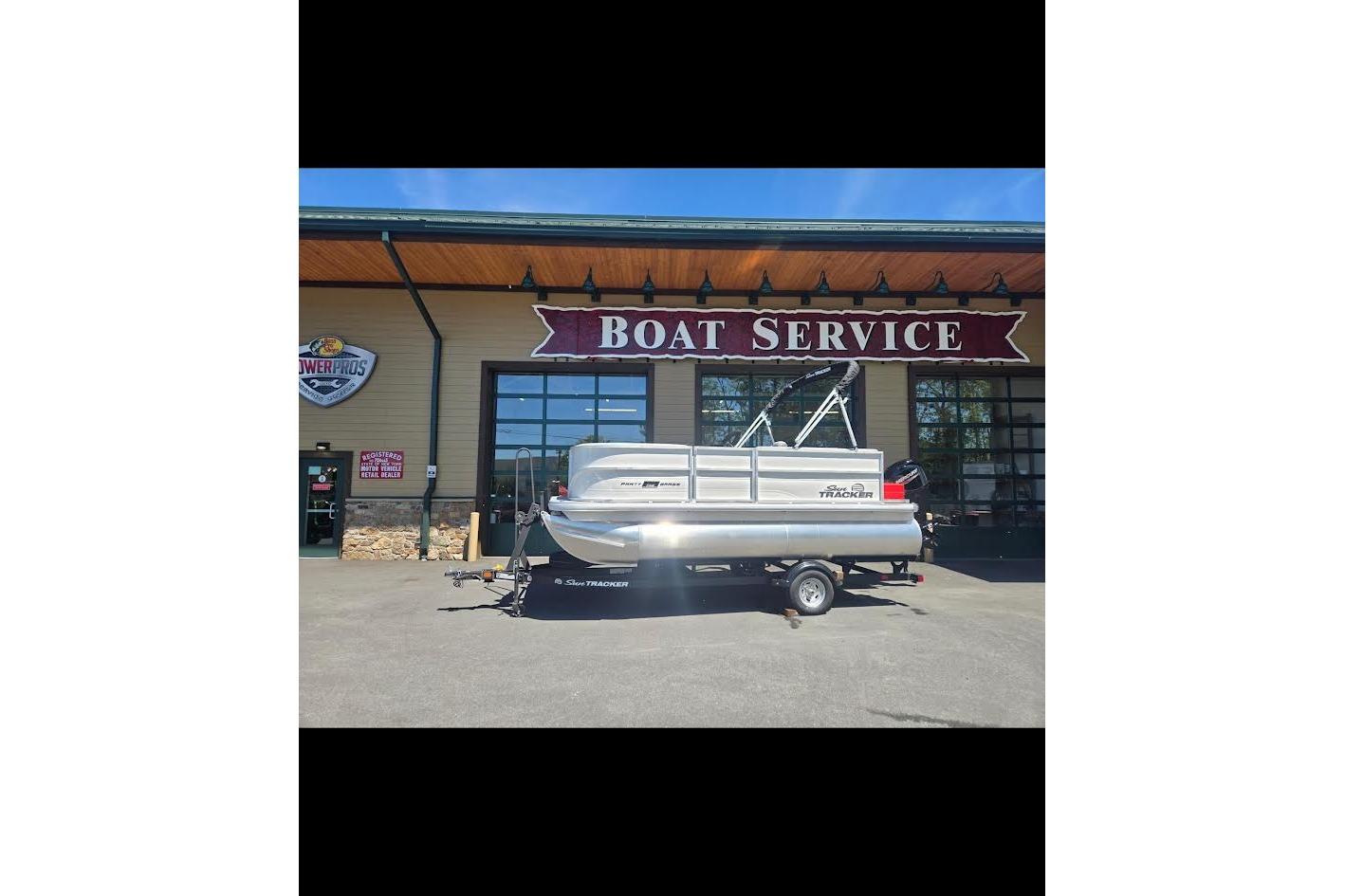 2026 Sun Tracker Party Barge 16 DLX pontoon boat at boat service center.