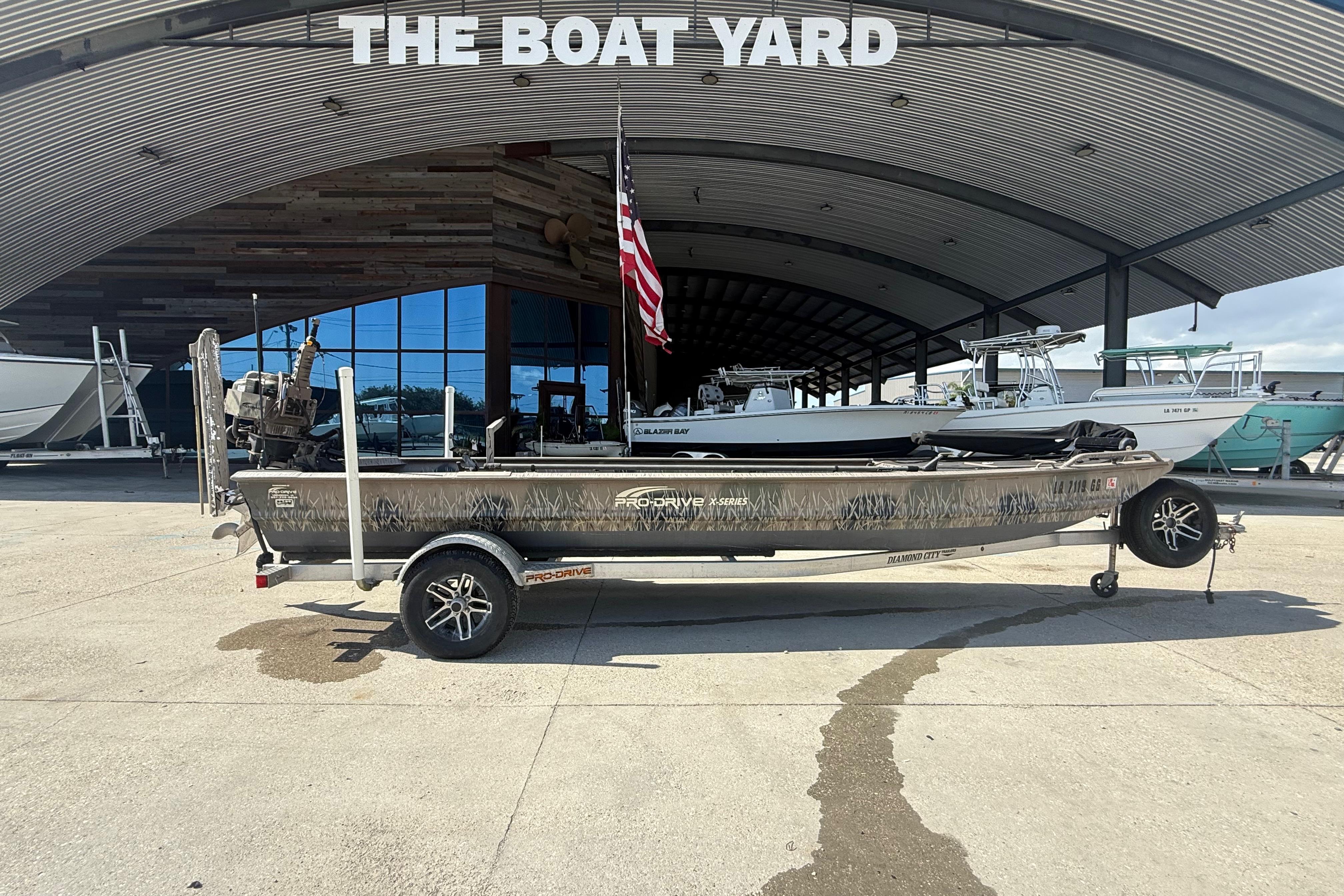 2017 Pro-Drive 2048 boat on trailer at The Boat Yard dealership.
