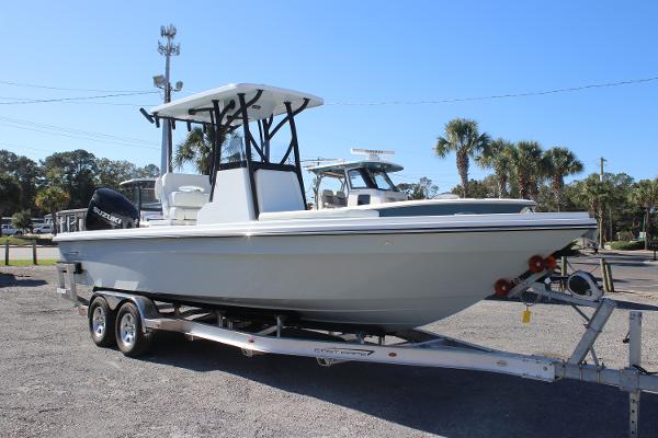 2025 East Cape 25 Open boat on trailer, parked outdoors under clear blue sky.