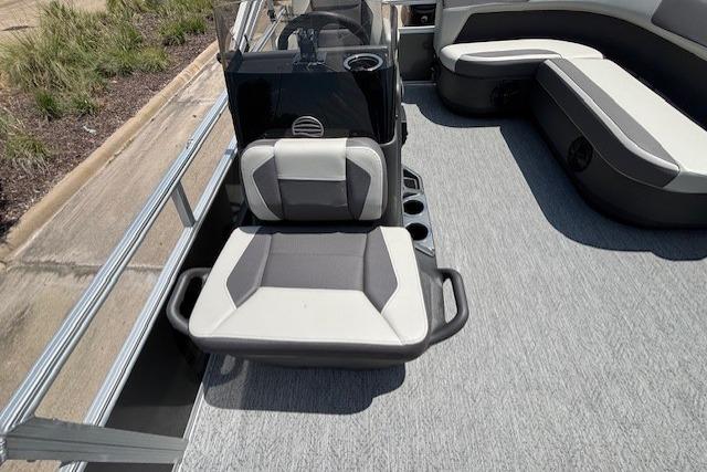 2026 Sun Tracker Bass Buggy 16 XL Select pontoon boat interior with seating and console.