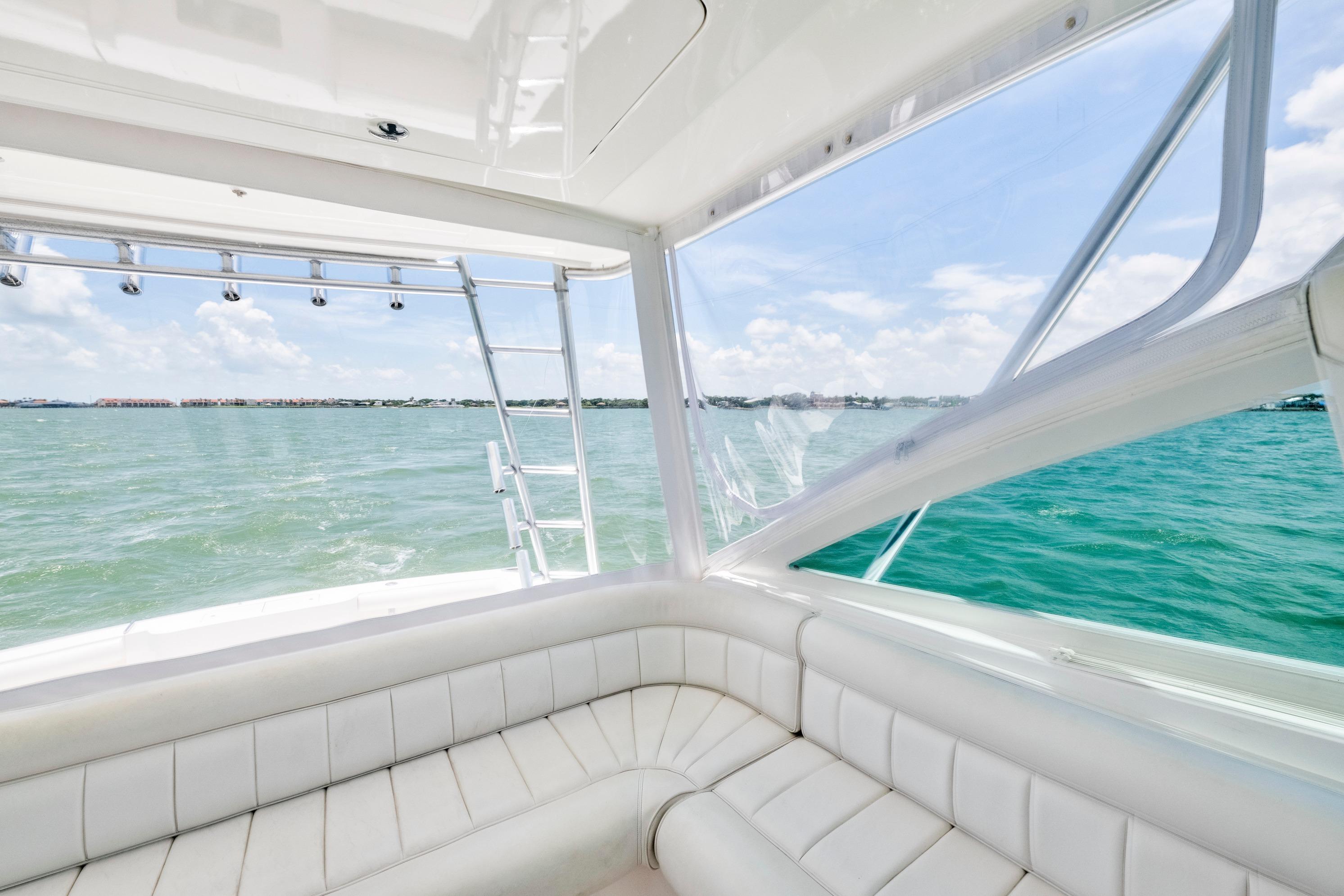 Interior view of 2010 Cabo 45 Express yacht with ocean backdrop.