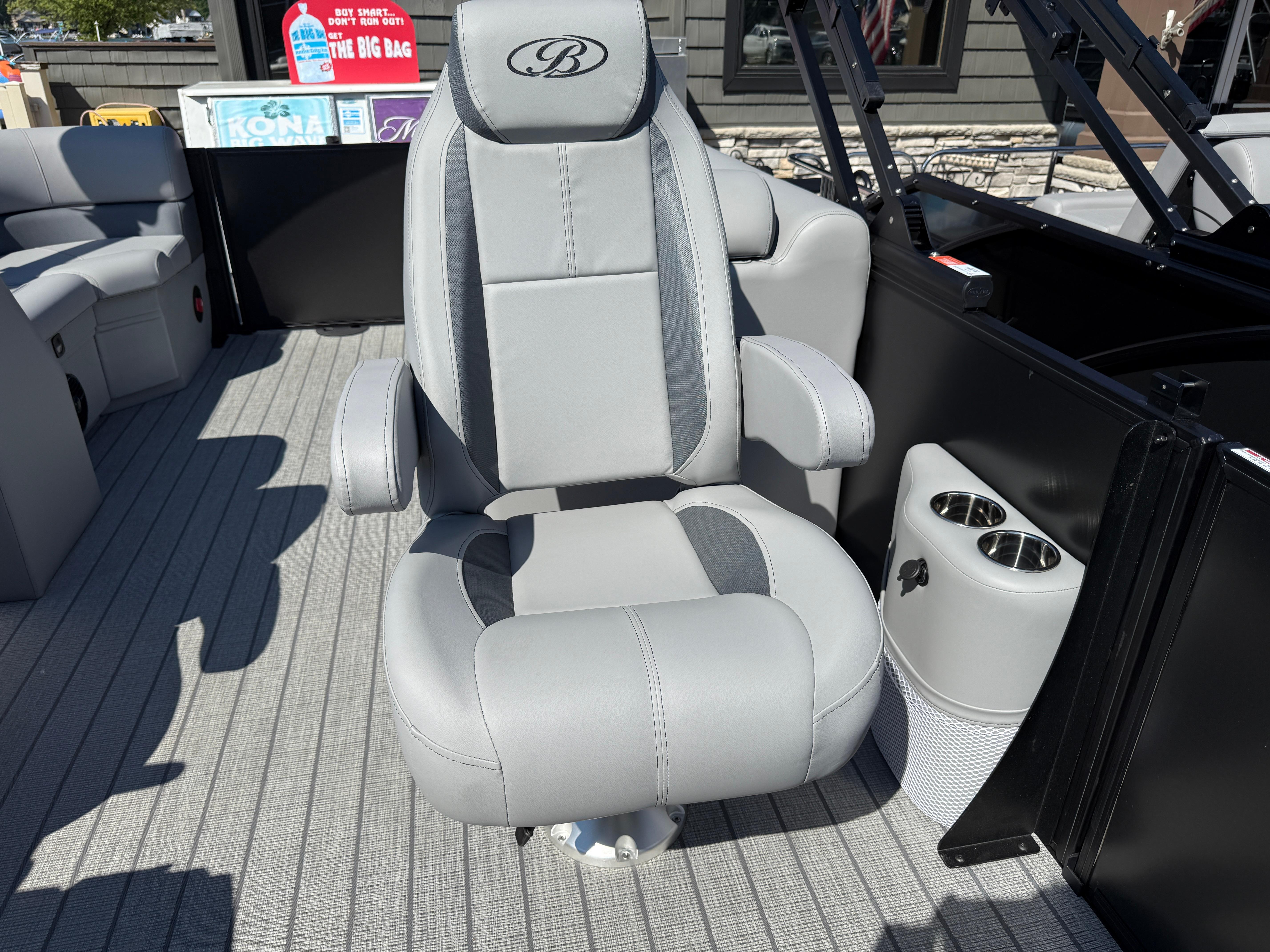 Captain's chair on 2026 Bentley Pontoons Legacy 223 Navigator, featuring cup holders and sleek design.
