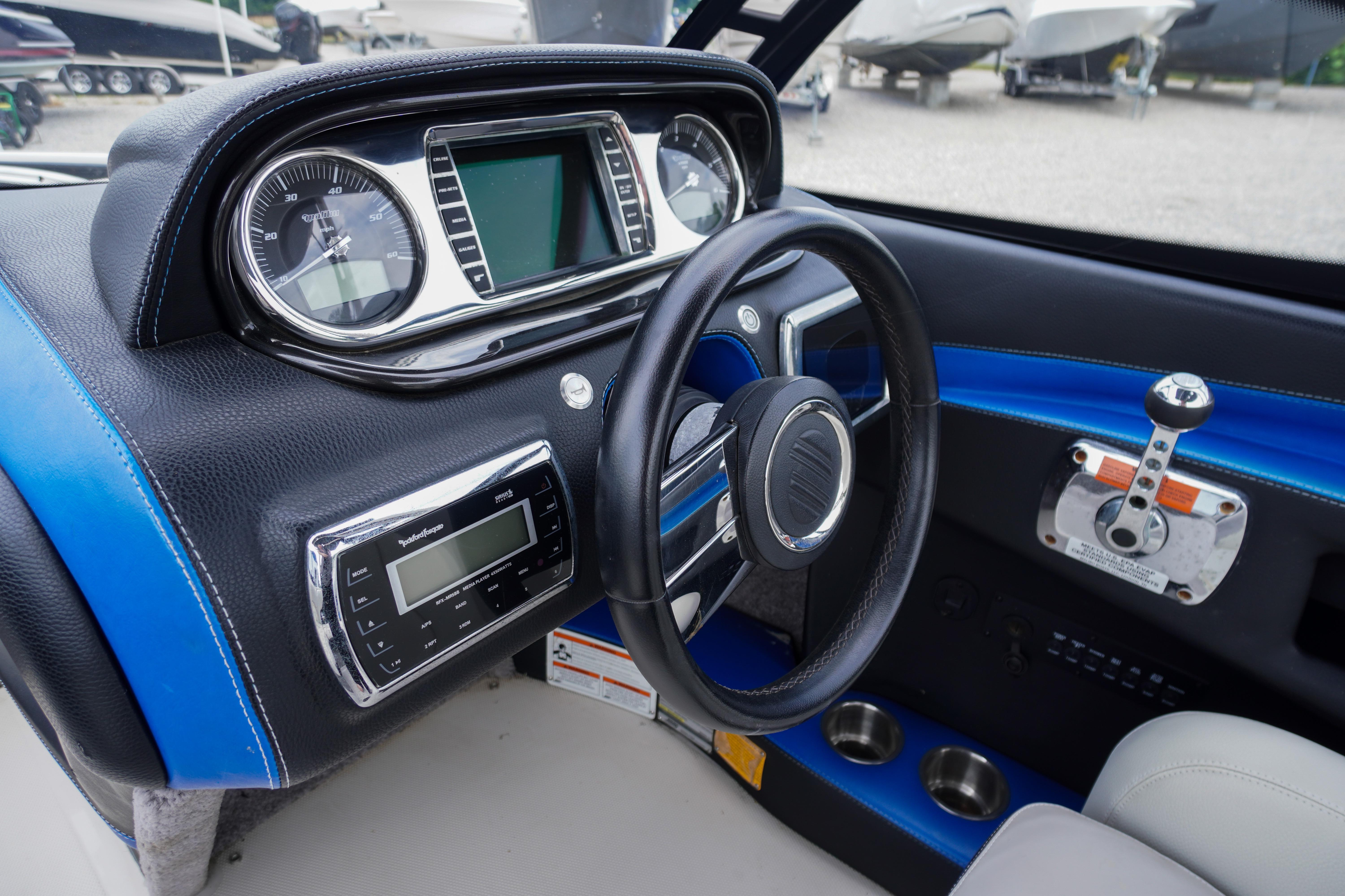 2011 Malibu Wakesetter 21 VLX dashboard with steering wheel and control panel.