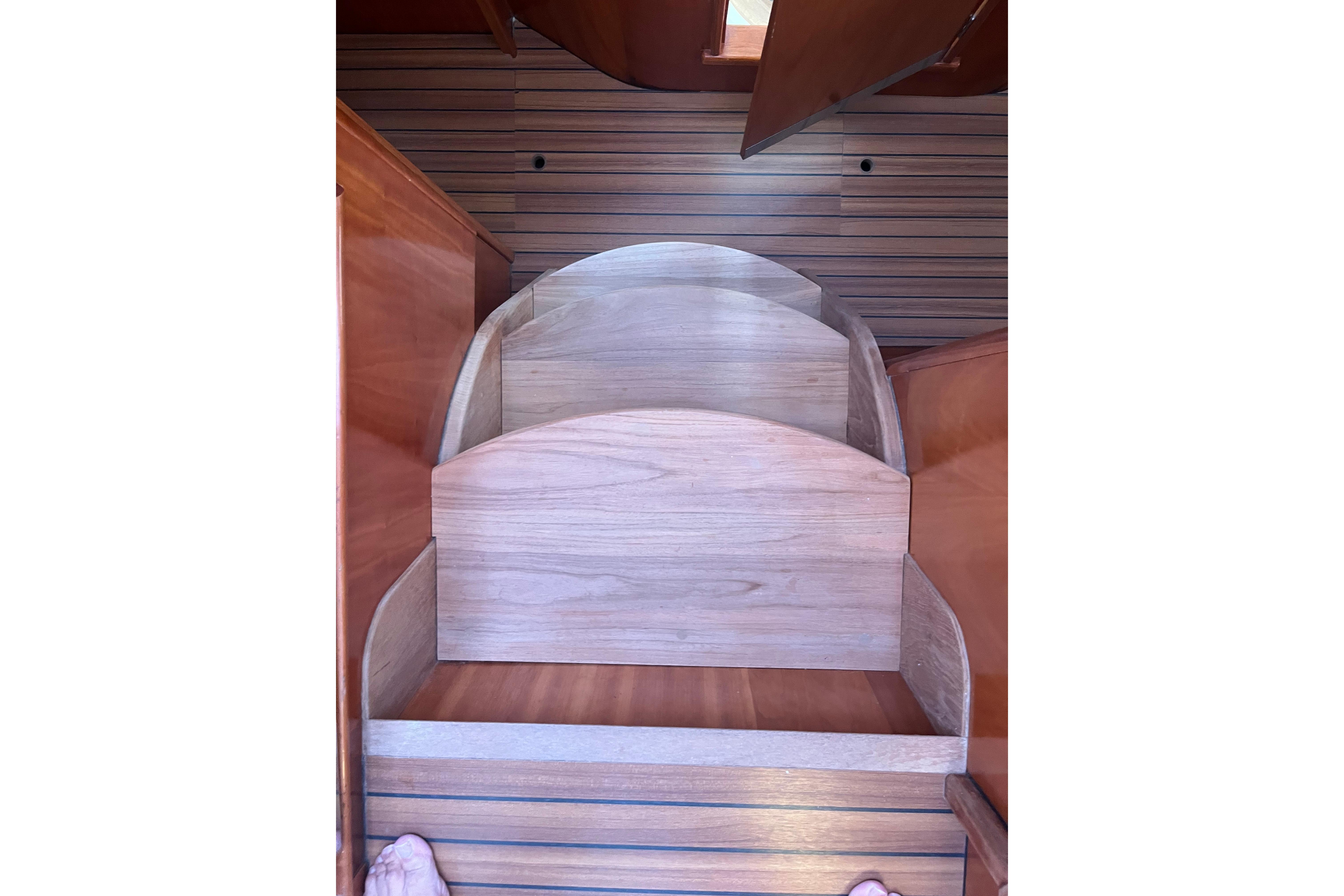 Wooden steps inside a 2004 Catana 471 Ocean Class Owner's Version yacht.