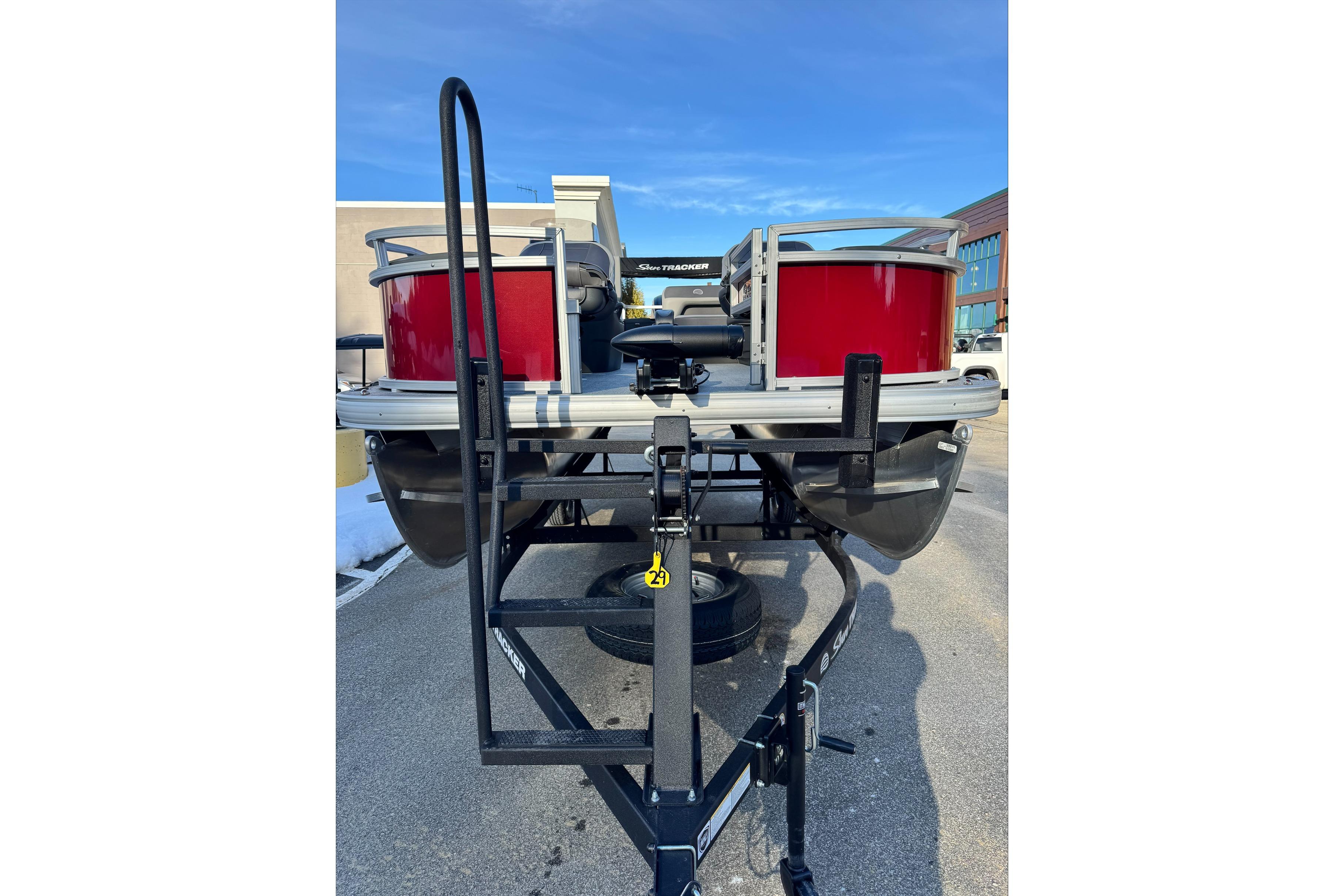 2026 Sun Tracker Bass Buggy 18 DLX pontoon boat on trailer, rear view.