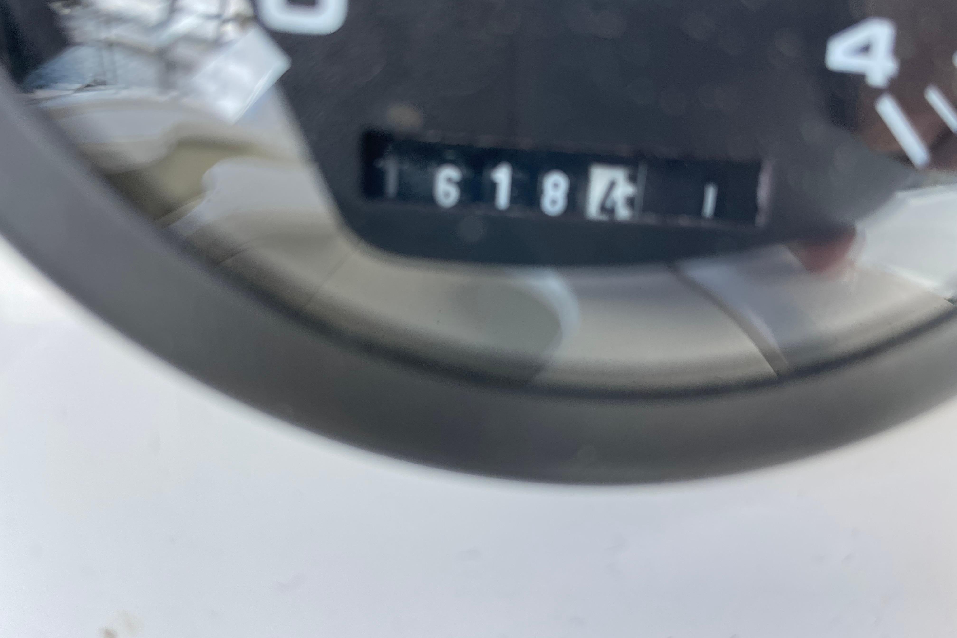 Close-up of a Hunter 340 speedometer, displaying 161841 miles, from the year 2000.