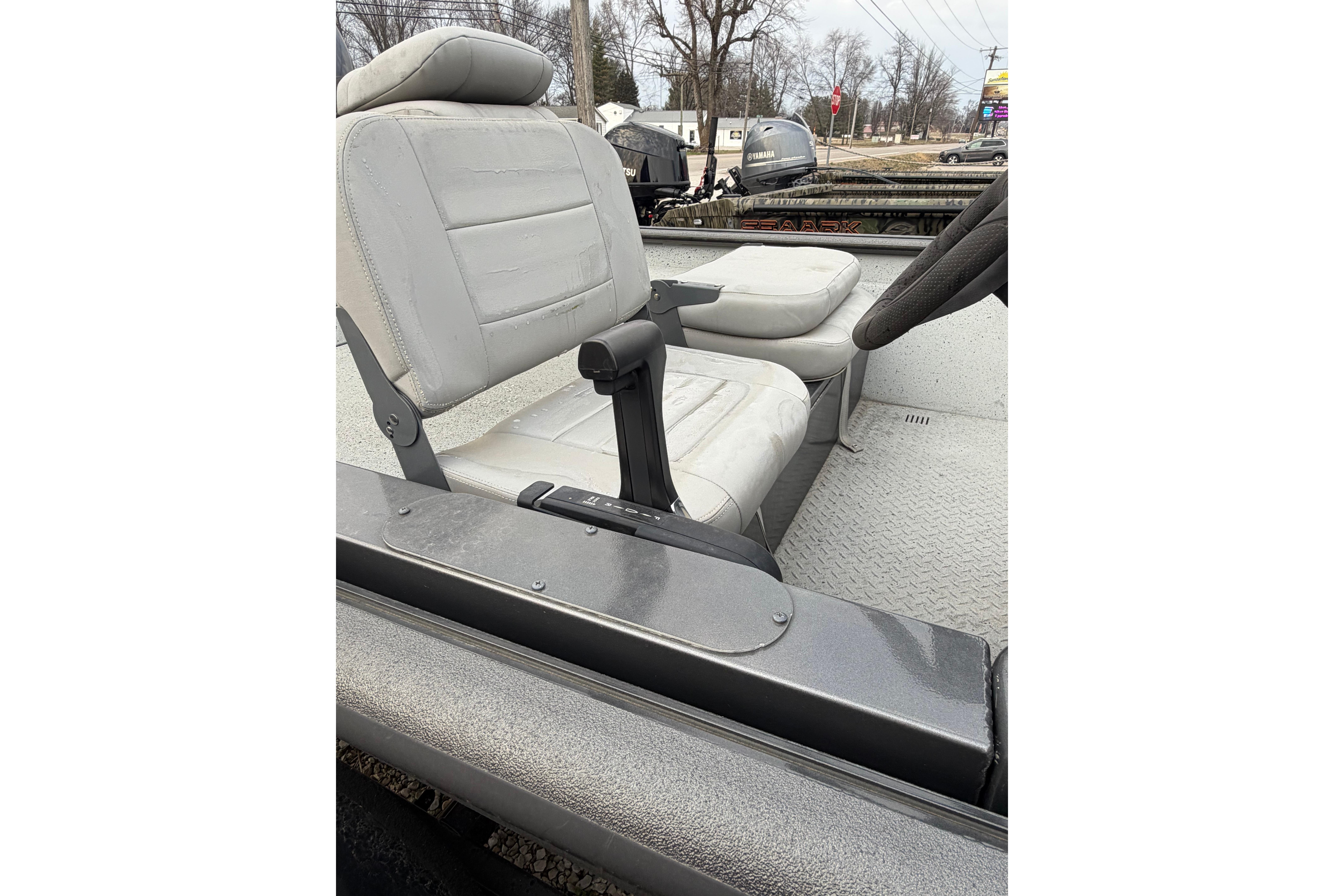 2023 SeaArk 180 RX boat interior with gray seating and steering wheel.