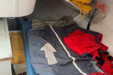 Interior of 1980 Beneteau Half Tonner sailboat with sailing gear and equipment.