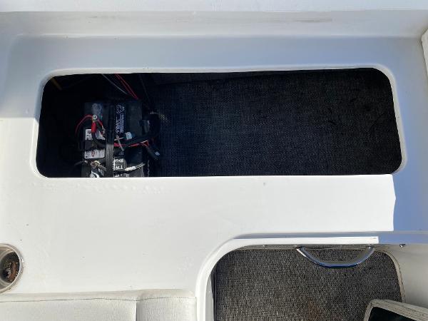 2019 Caravelle 19 EBo Bowrider battery compartment with visible wiring.