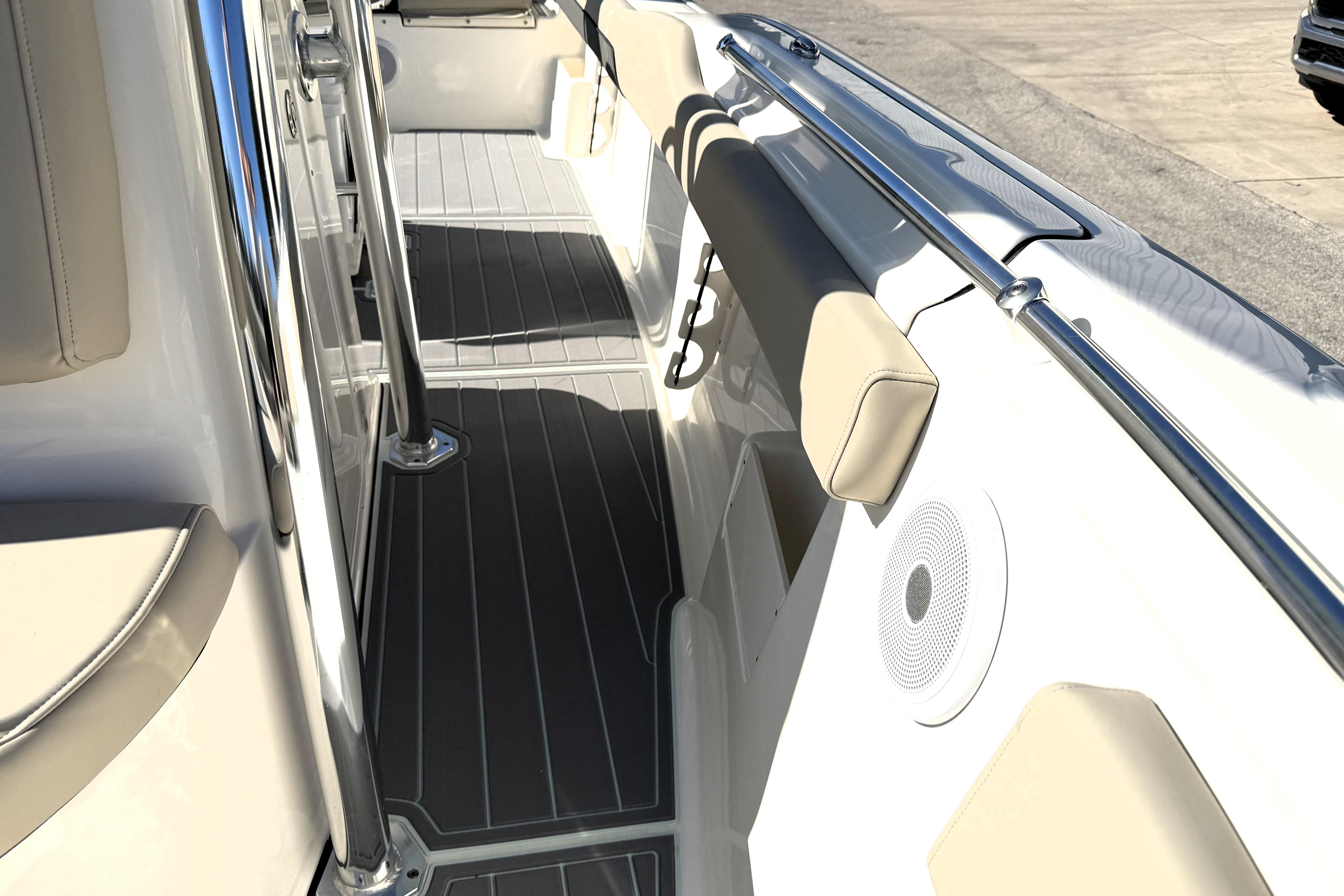 2025 Key West 239 FS boat interior with cushioned seating and sleek design.