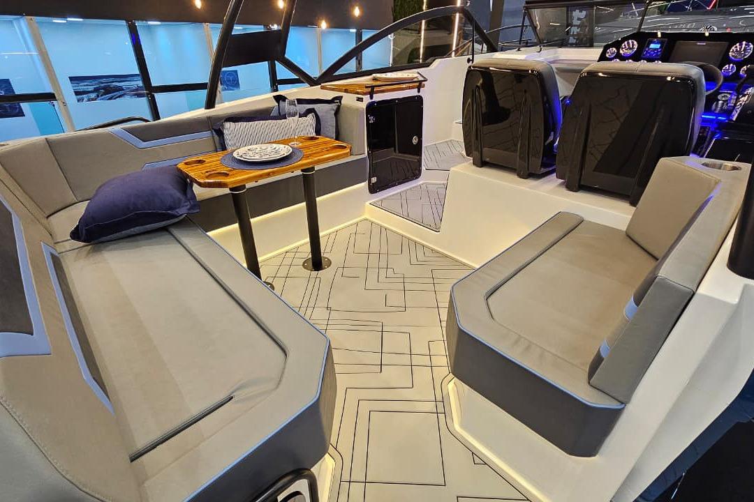 Luxurious interior of 2026 Hanover 327 boat with elegant seating and modern design.