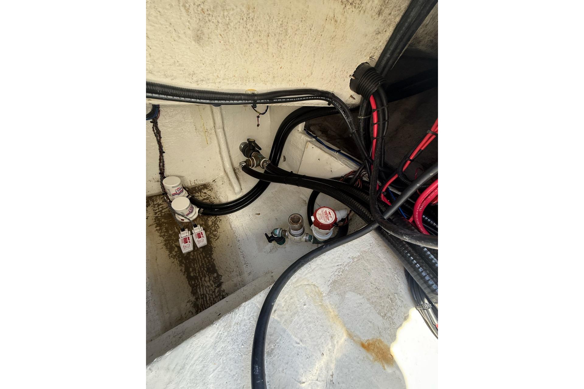 Interior view of 2021 Custom Infusion 34 CC boat wiring and plumbing system.