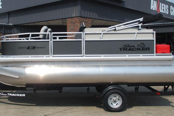 2026 Sun Tracker Bass Buggy 16 XL Select pontoon boat on trailer, side view.