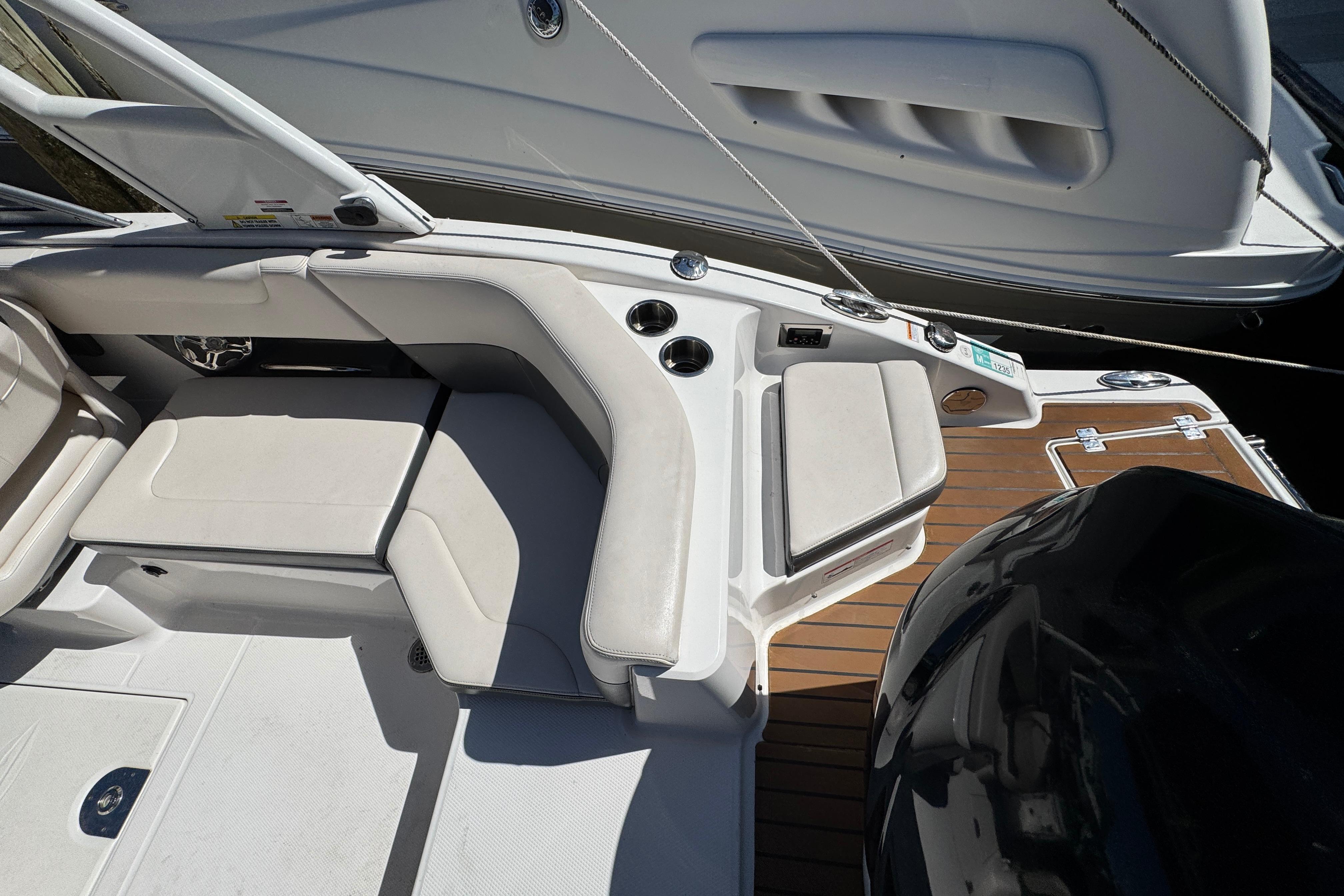 2018 Chaparral 250 Suncoast boat interior with seating and teak flooring.