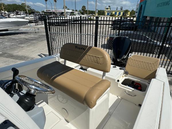2021 Bayliner Trophy T22CC boat interior with tan seating and steering wheel.