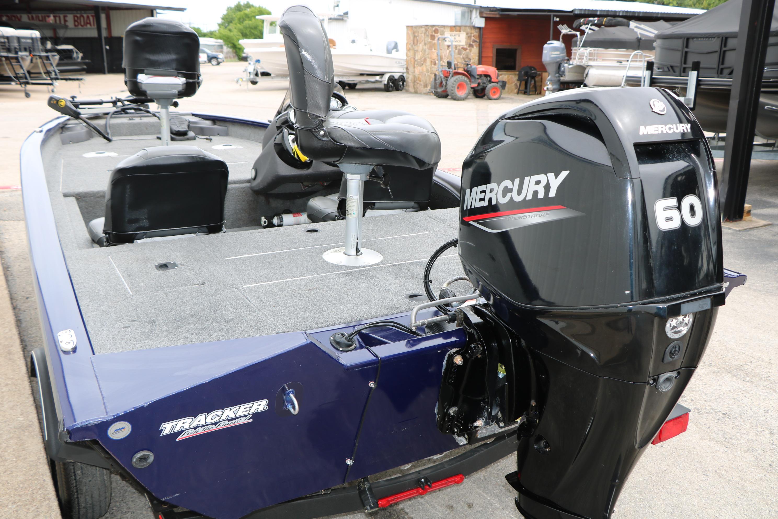 2022 Tracker Pro Team 175 TF boat with Mercury 60 engine, parked outdoors.