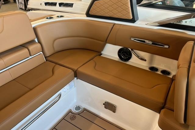 2025 Chaparral 247 SSX boat interior with tan leather seating and modern design.