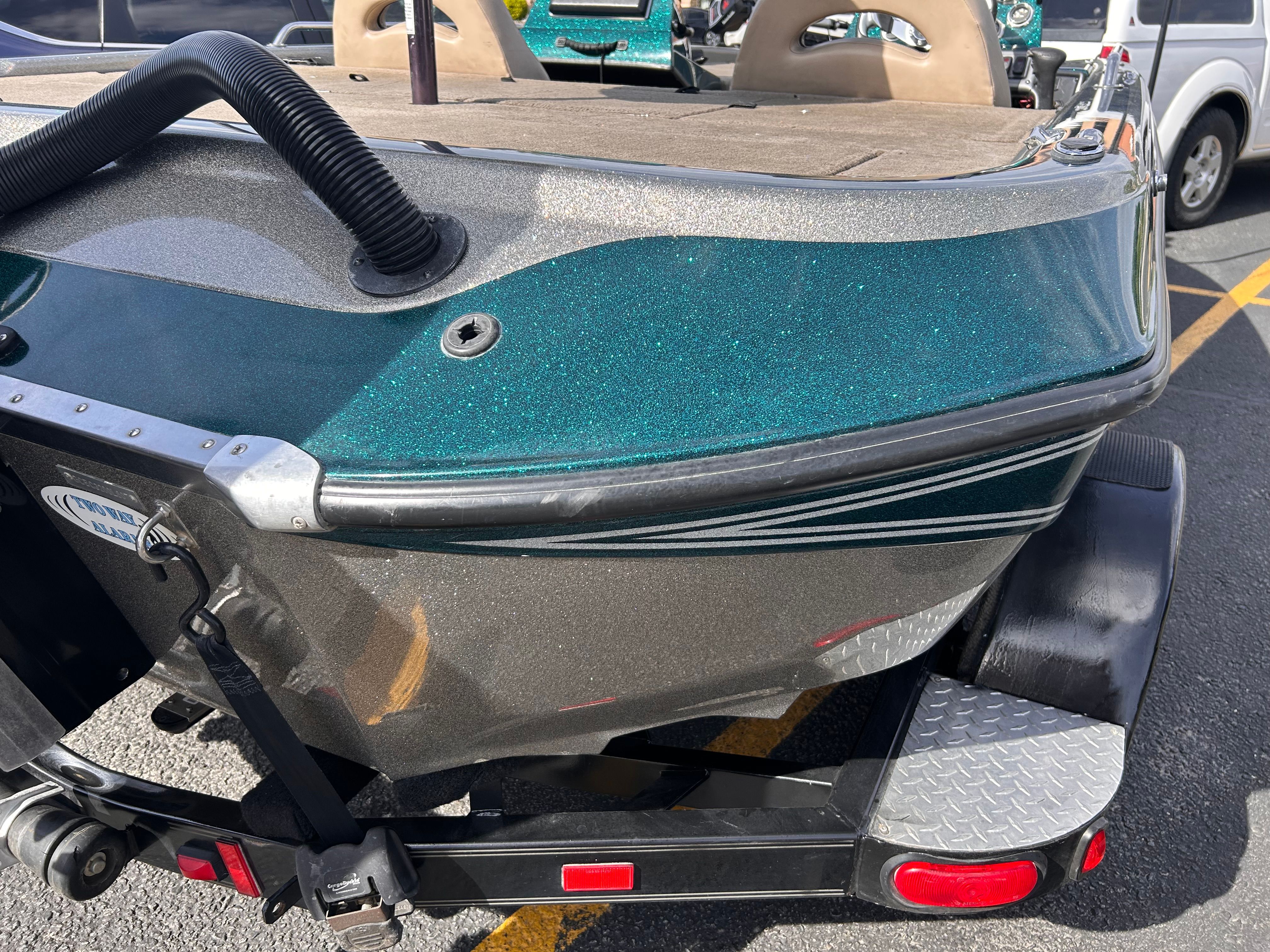 2008 Champion 183 boat on trailer parked outdoors.