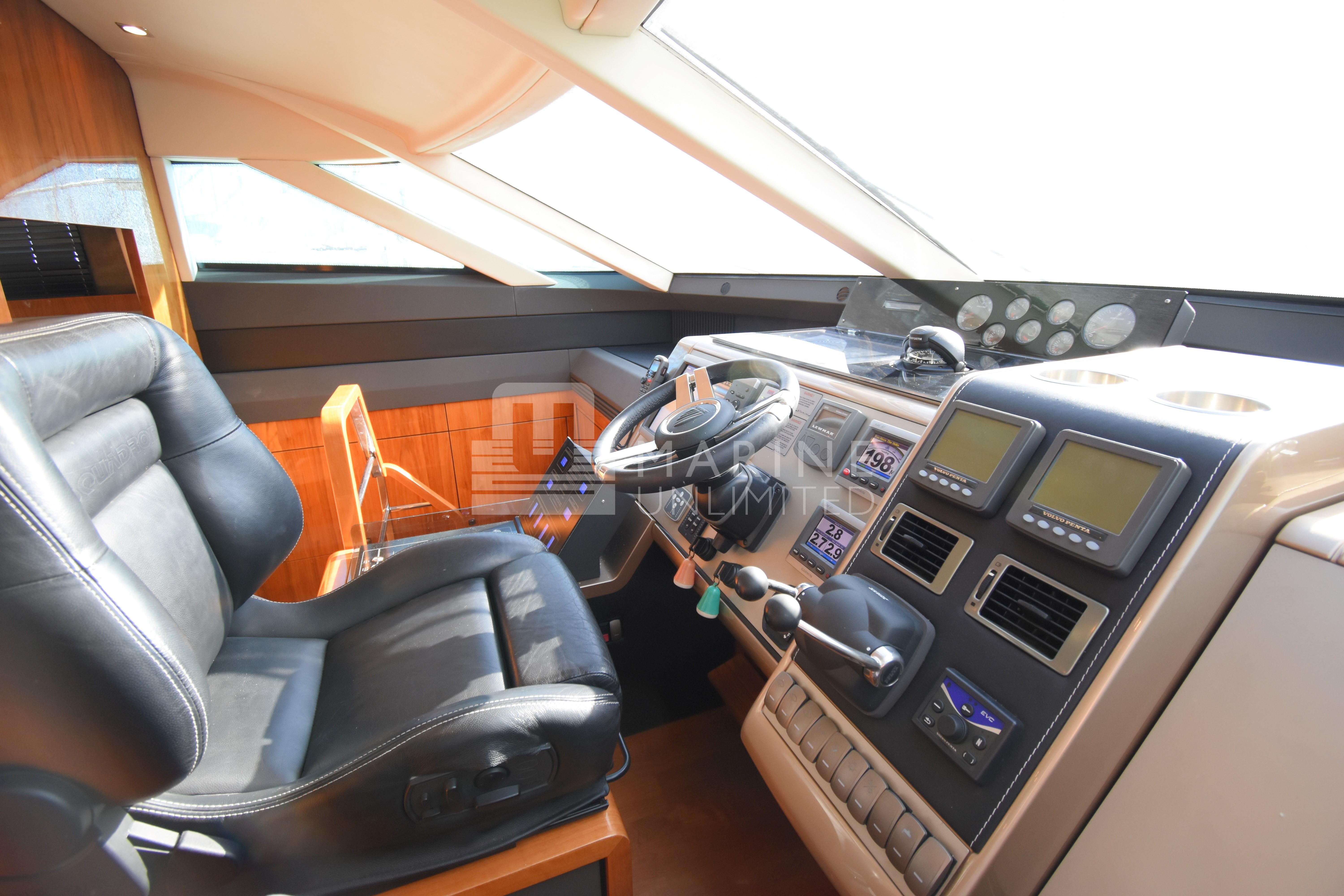 Cockpit of 2010 Fairline Squadron 55 yacht with leather seat and advanced navigation controls.