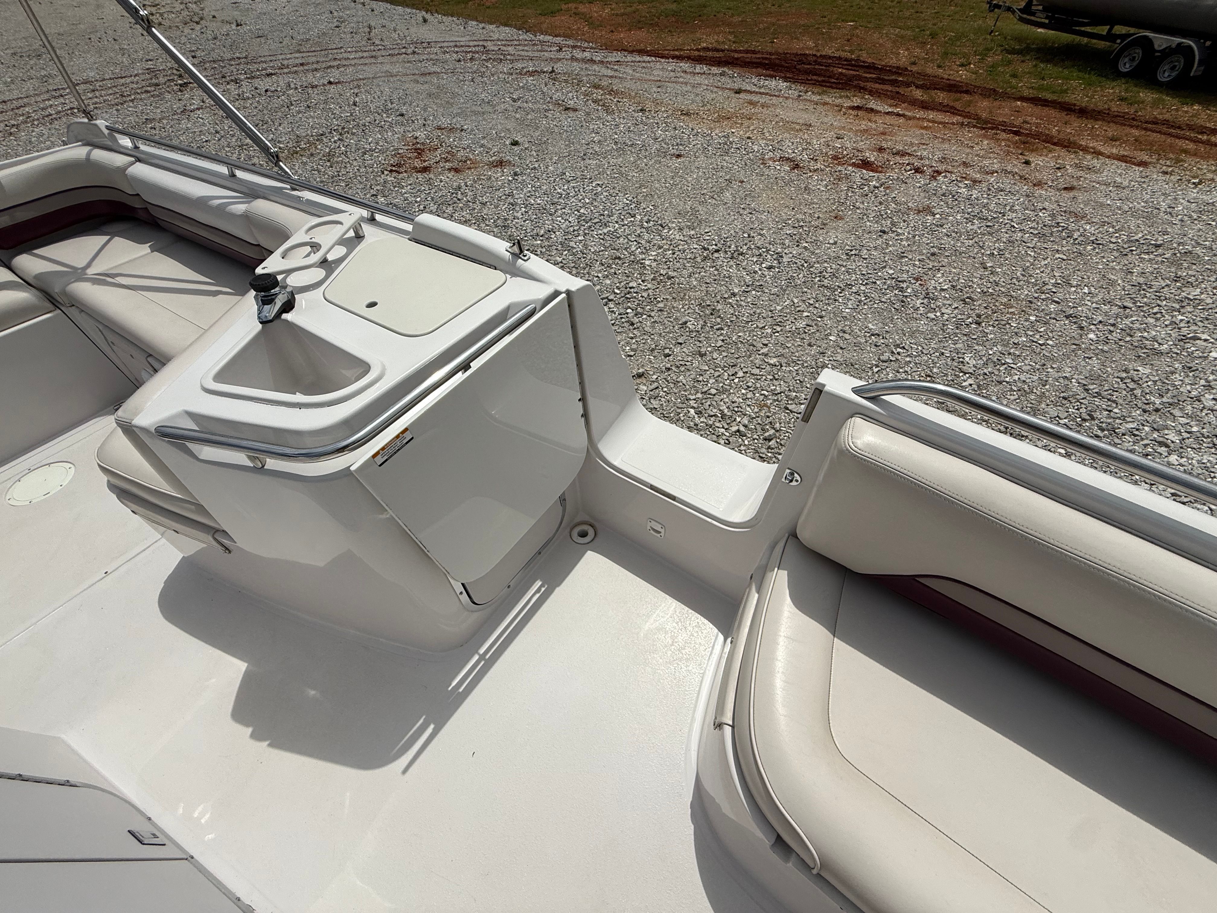 The image shows the cockpit of a 1994 Chaparral Sunesta 220 with seating and a sink.