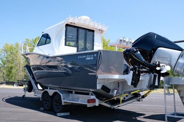2023 Makaira Gen3 800 boat on trailer, featuring sleek design and powerful outboard motor.