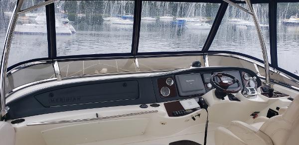 Interior view of 2010 Meridian 441 Sedan yacht cockpit with navigation controls.