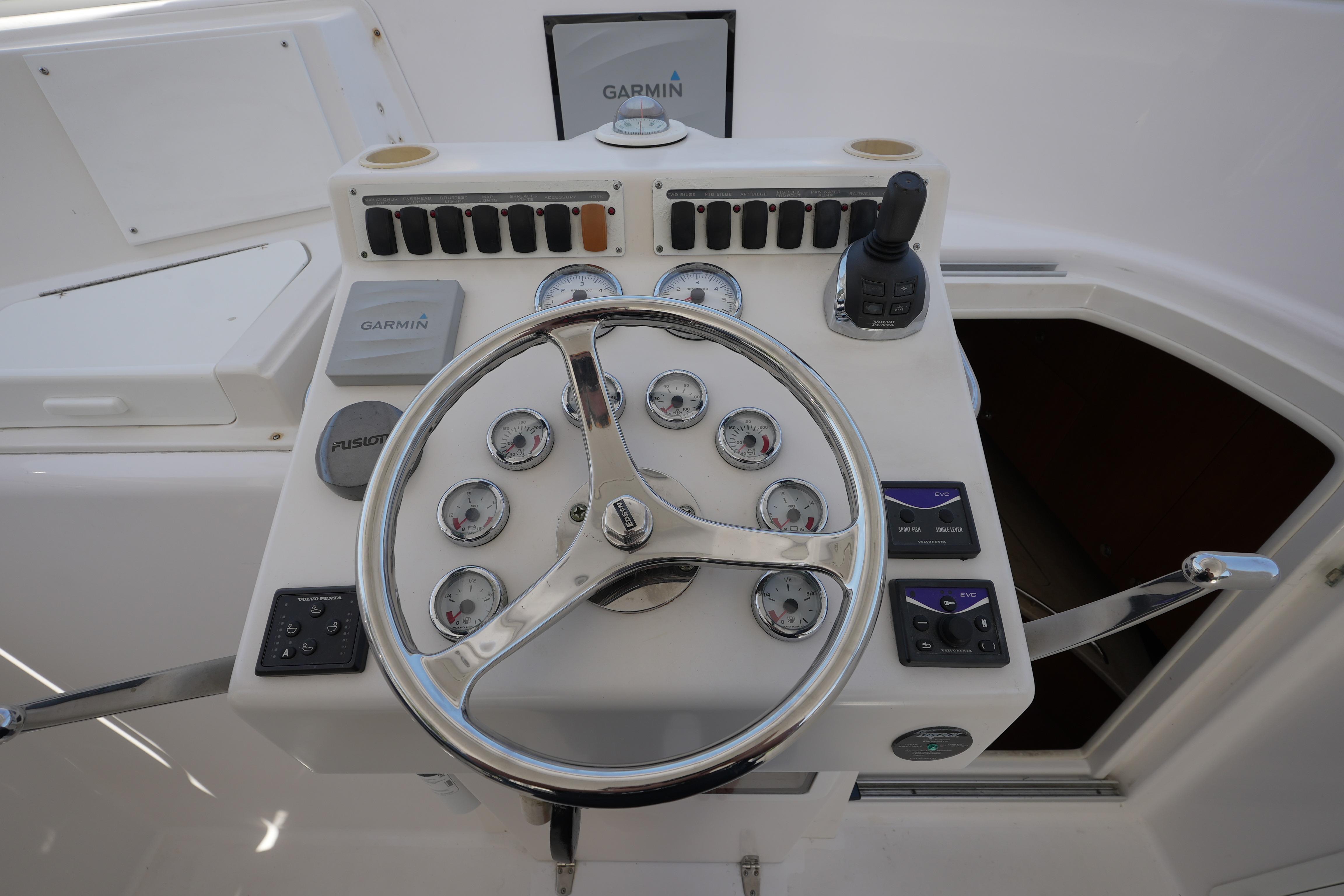 Steering console of 2012 Custom Carolina 34 boat with Garmin navigation system.