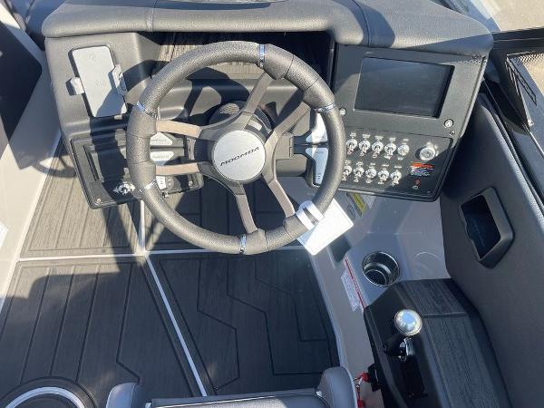 2025 Moomba Mondo boat dashboard with steering wheel and control panel.