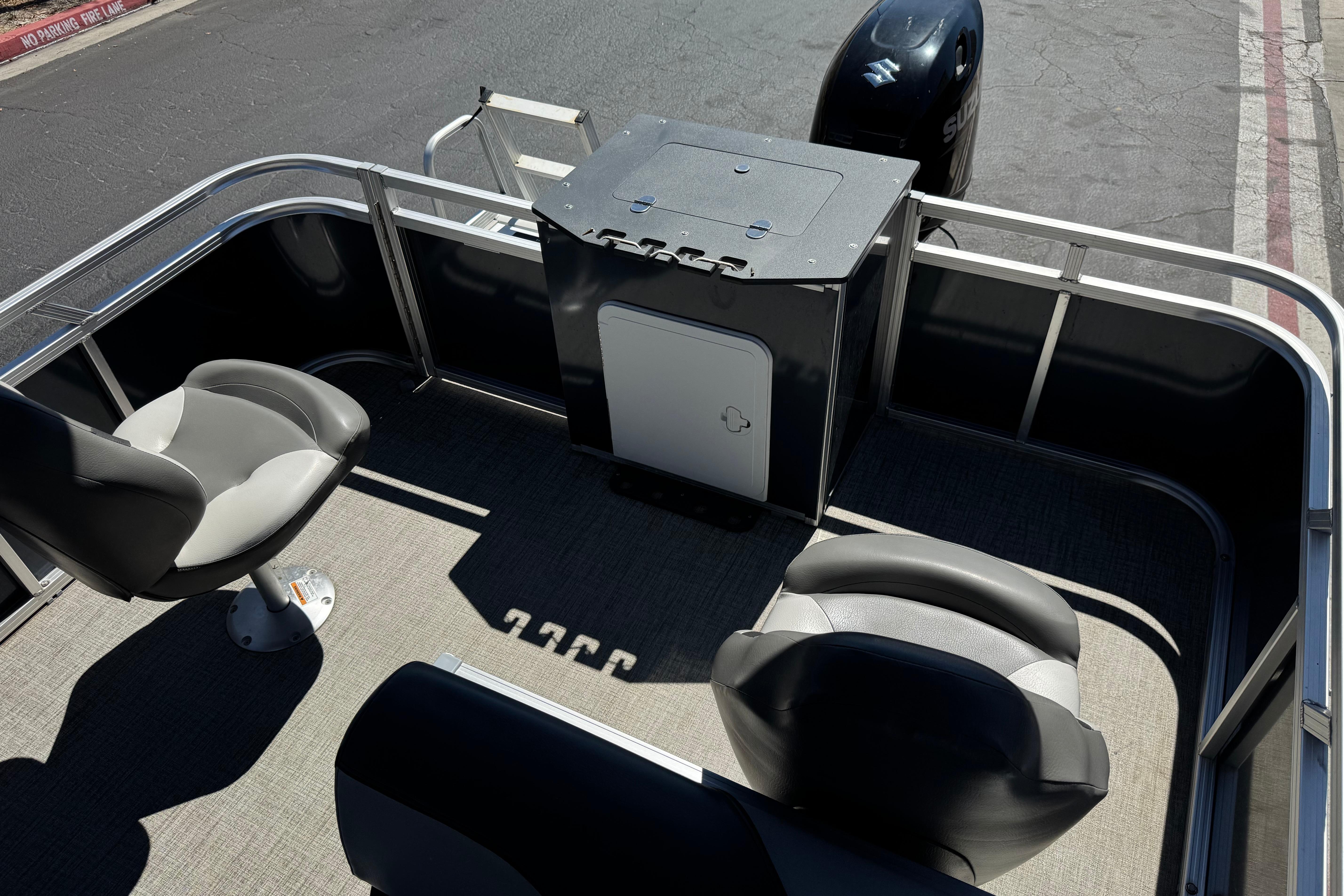 2023 Avalon Venture Fish N Cruise 20' boat interior with seating and motor.