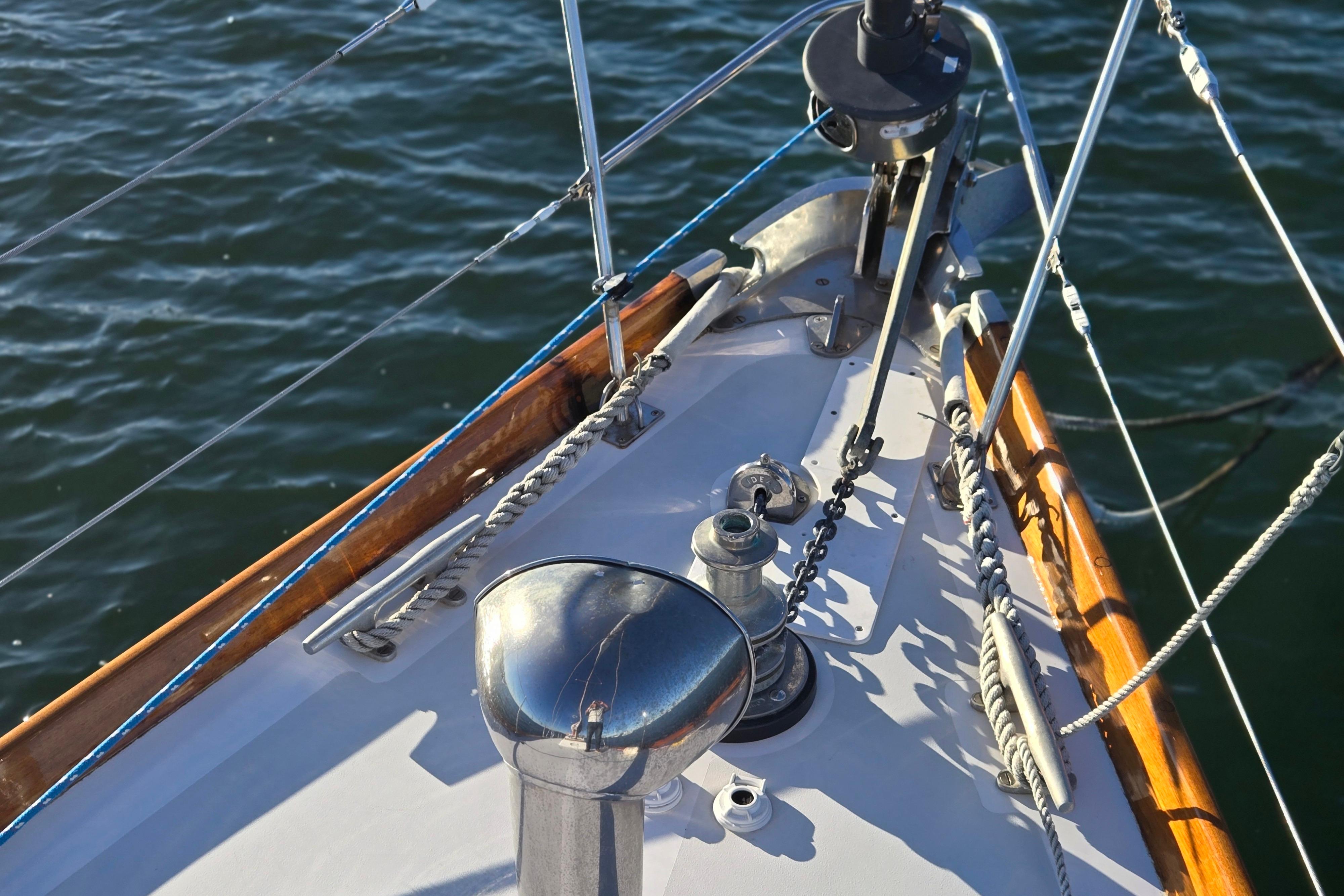 Bow of a 1970 Hinckley Bermuda 40 sailboat with rigging details.