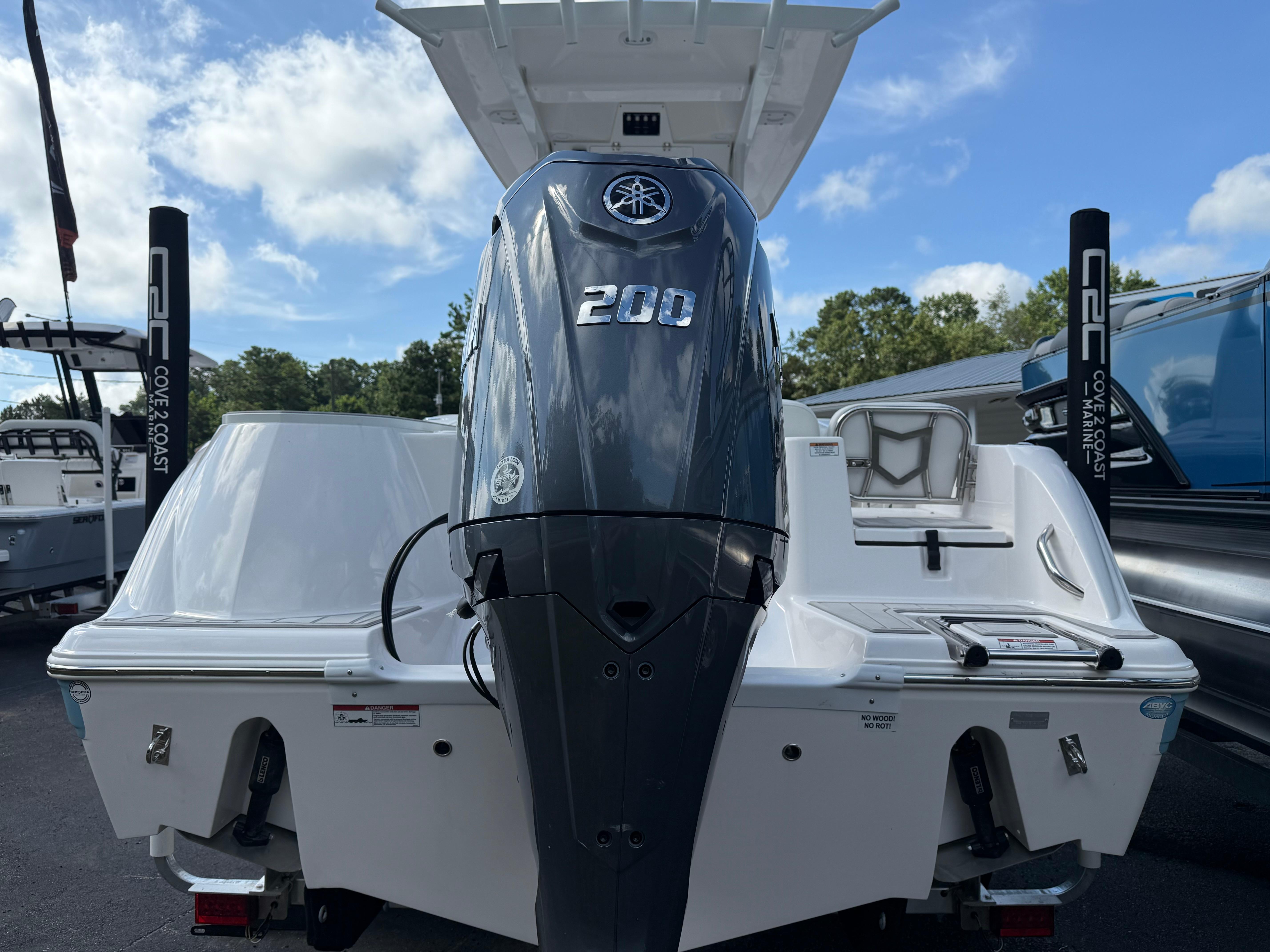 2026 Sea Fox 228 Commander boat with powerful 200 horsepower engine, displayed outdoors.