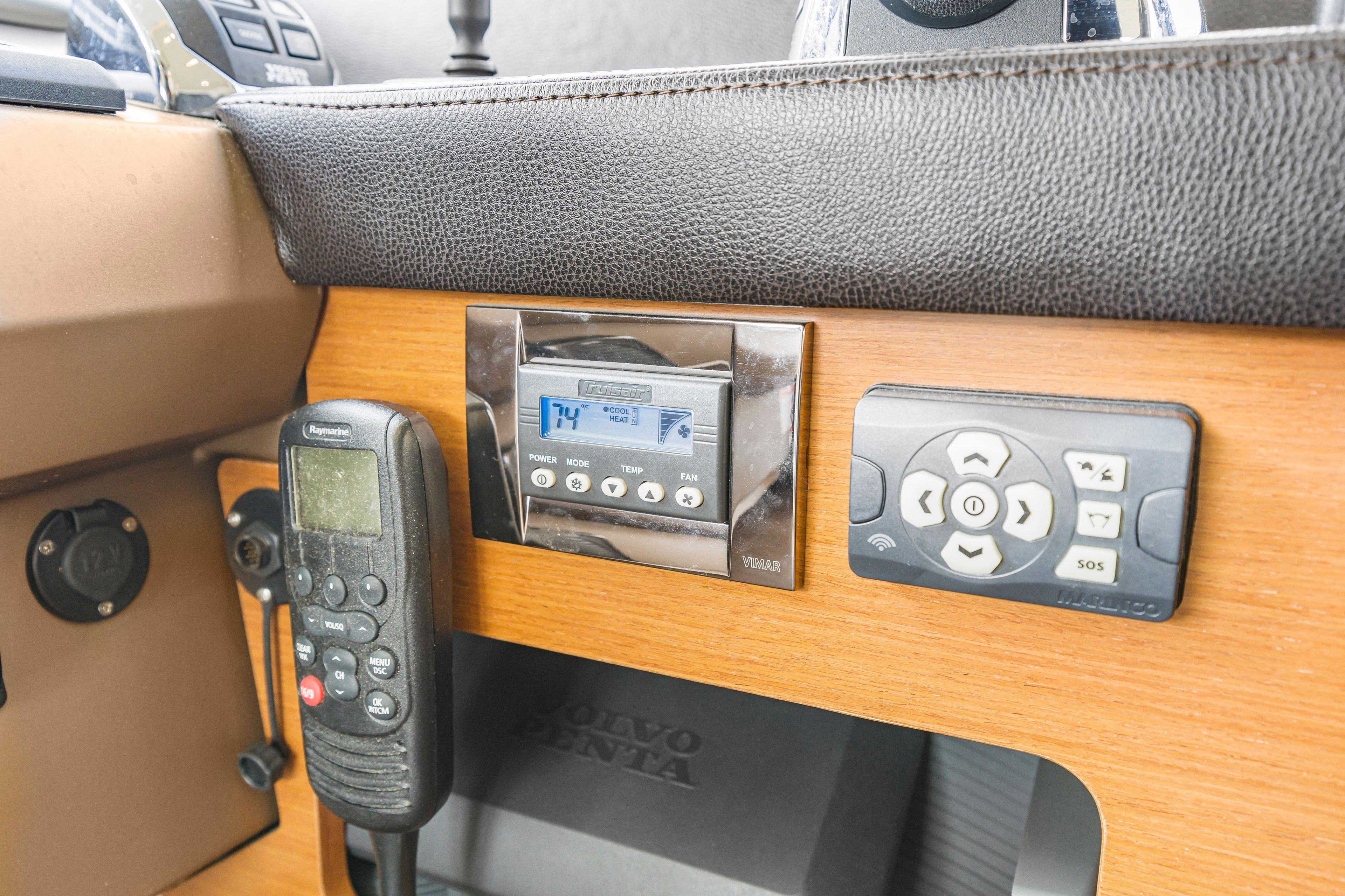 Control panel of a 2017 Prestige 500 yacht with electronic devices and displays.