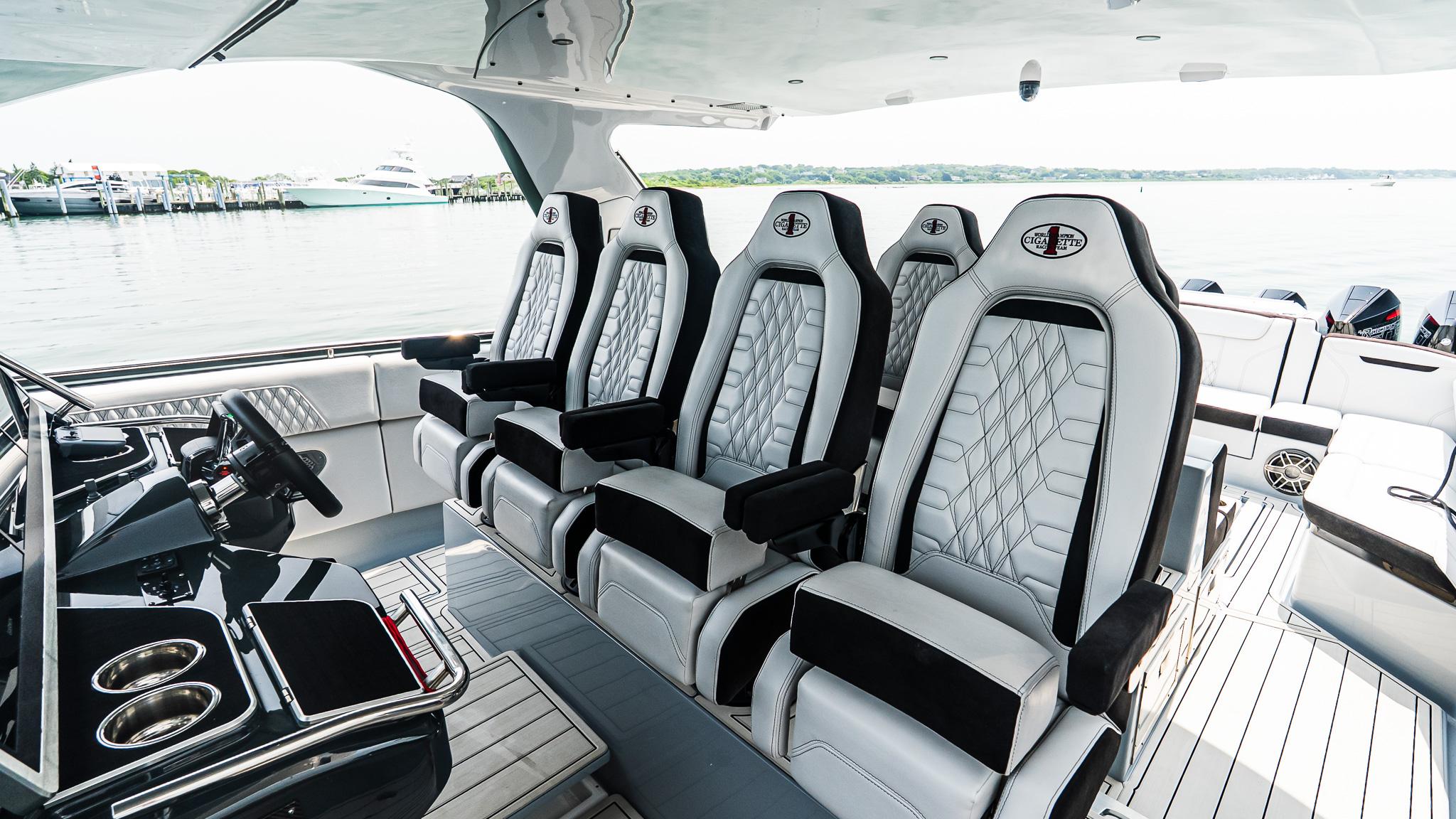 Luxury interior of 2025 Cigarette 52 Thunder boat with plush seating and sleek design.