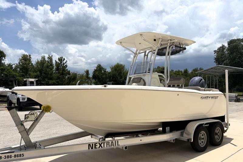 2023 Key West 203 FS boat on trailer under cloudy sky.