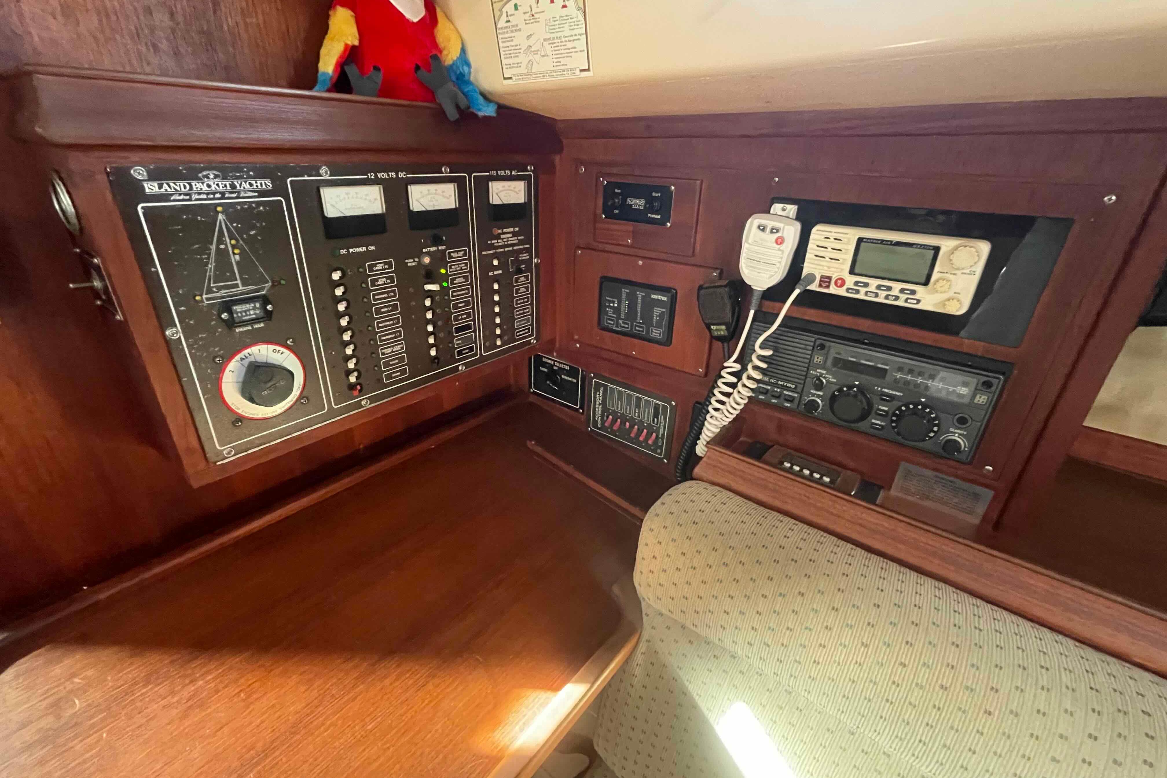 Control panel of a 1989 Island Packet 35 yacht with navigation and communication equipment.