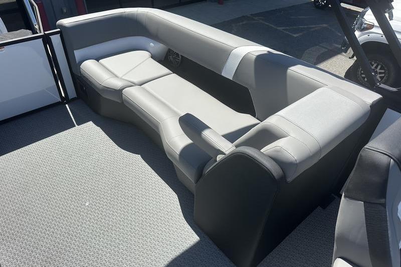 Luxurious seating area in 2026 Evotti 523QL boat, featuring sleek gray upholstery.