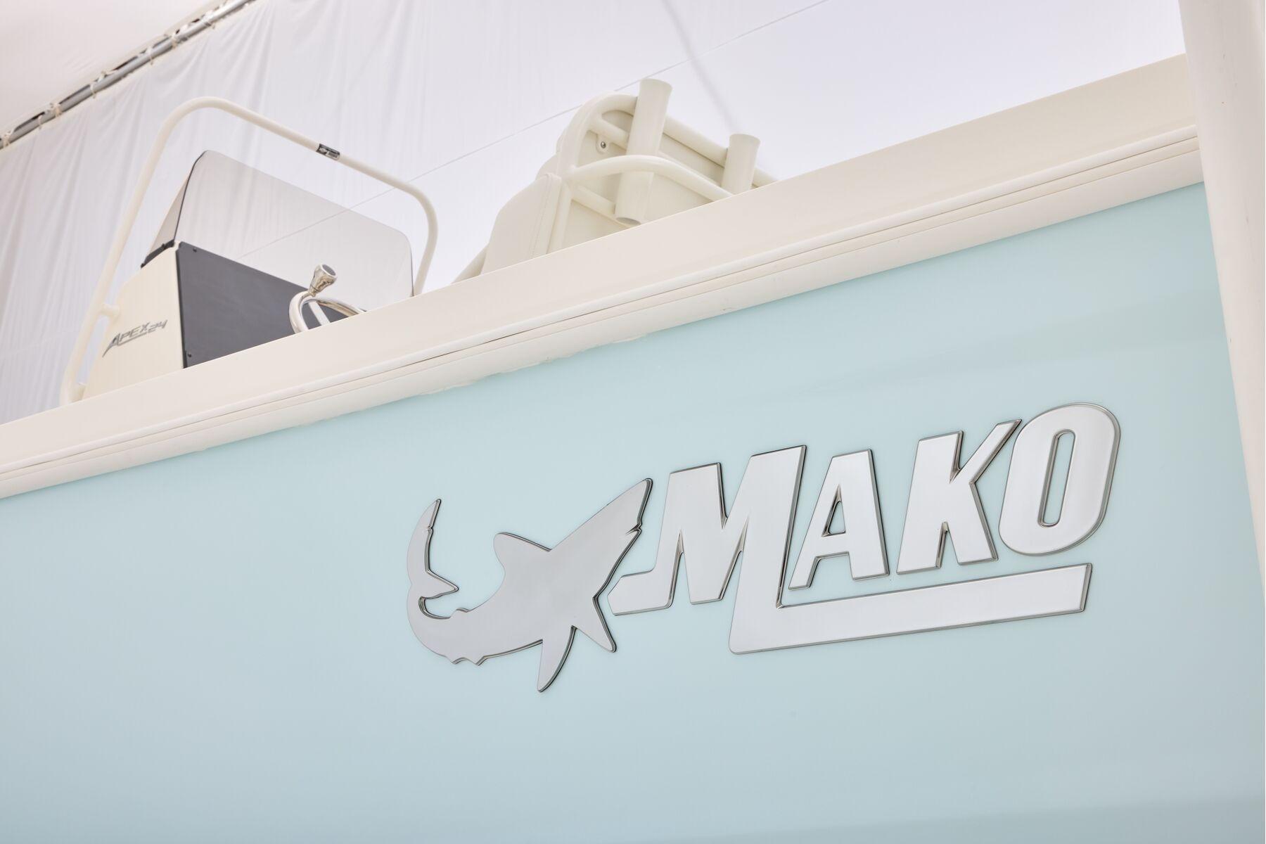 2026 Mako 24 APEX boat logo on light blue background.
