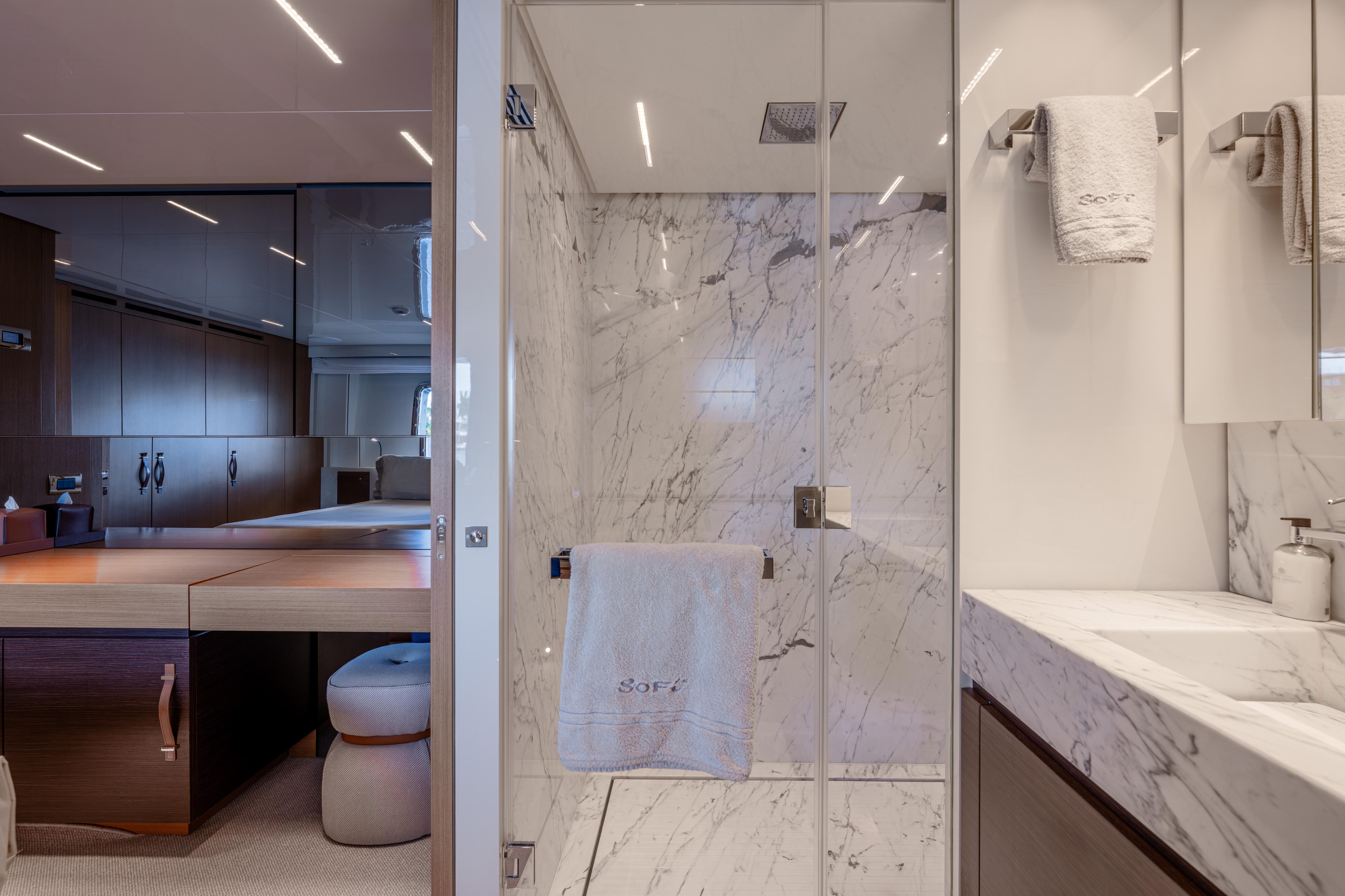 Luxurious bathroom on 2023 Sanlorenzo SL120A yacht with marble shower and modern vanity.