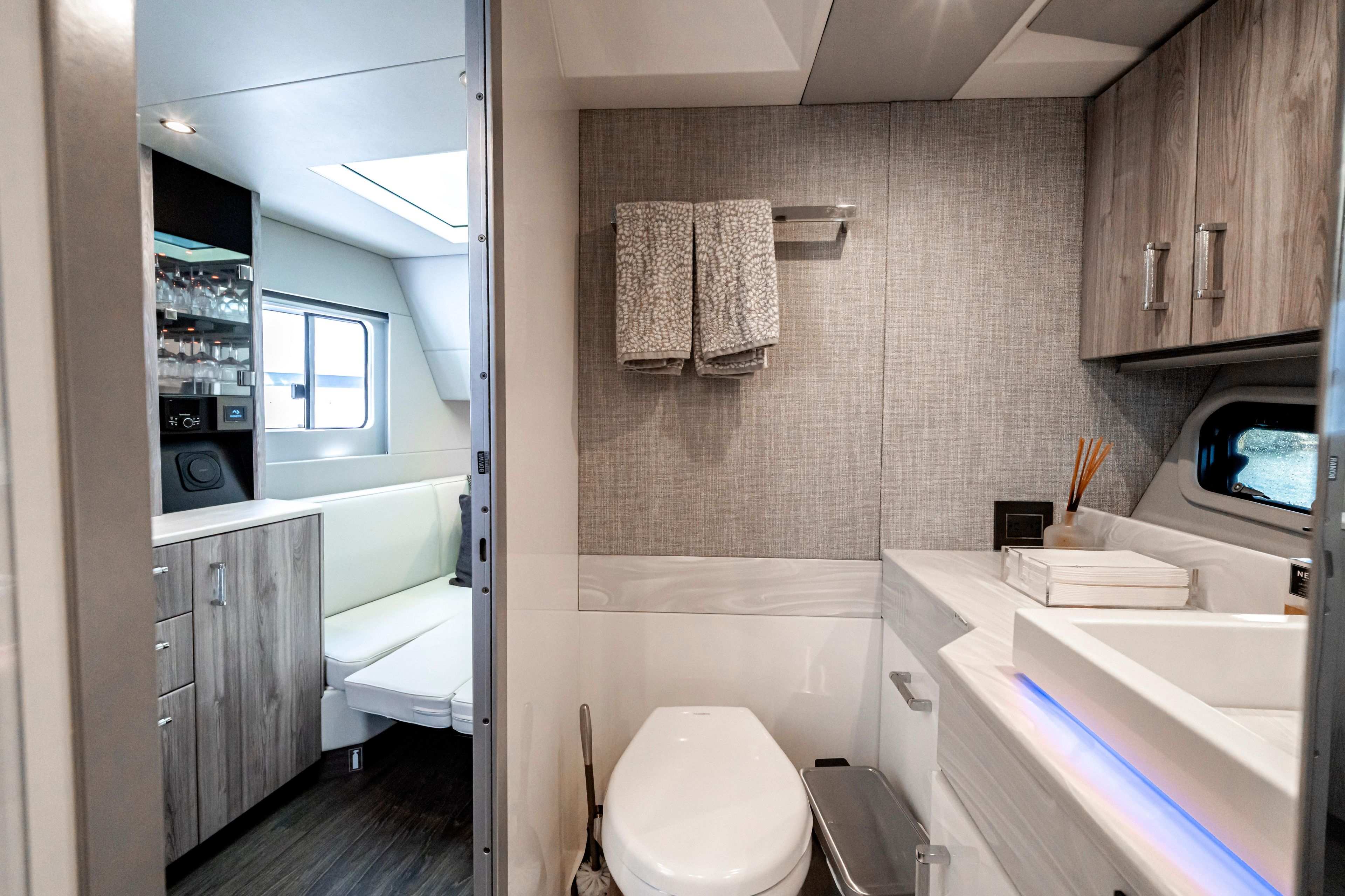 Luxurious interior of 2022 Formula 500 Super Sport Crossover yacht bathroom and lounge area.