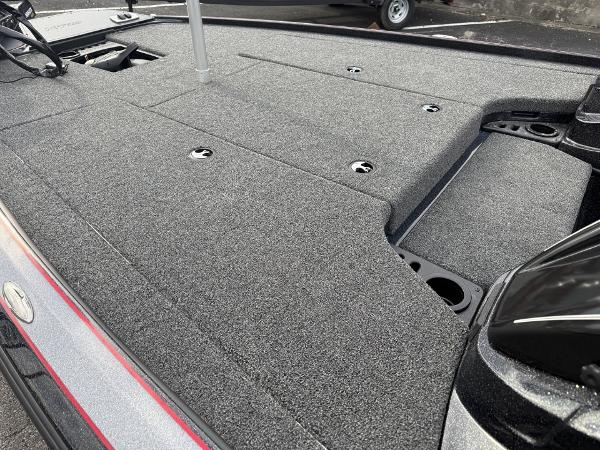 2025 Nitro Z19 boat deck with gray carpet and storage compartments.