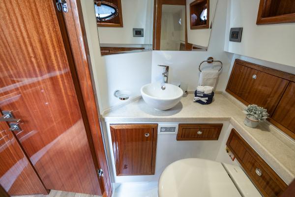 Luxurious bathroom in 2023 Vento V40 Retro Classic Open yacht with wooden cabinets.