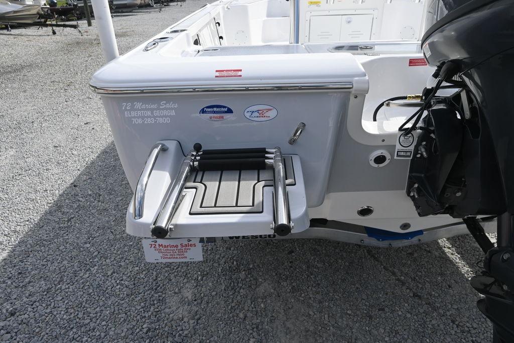 2026 Tidewater 1910 Bay Max boat with swim platform and outboard motor.